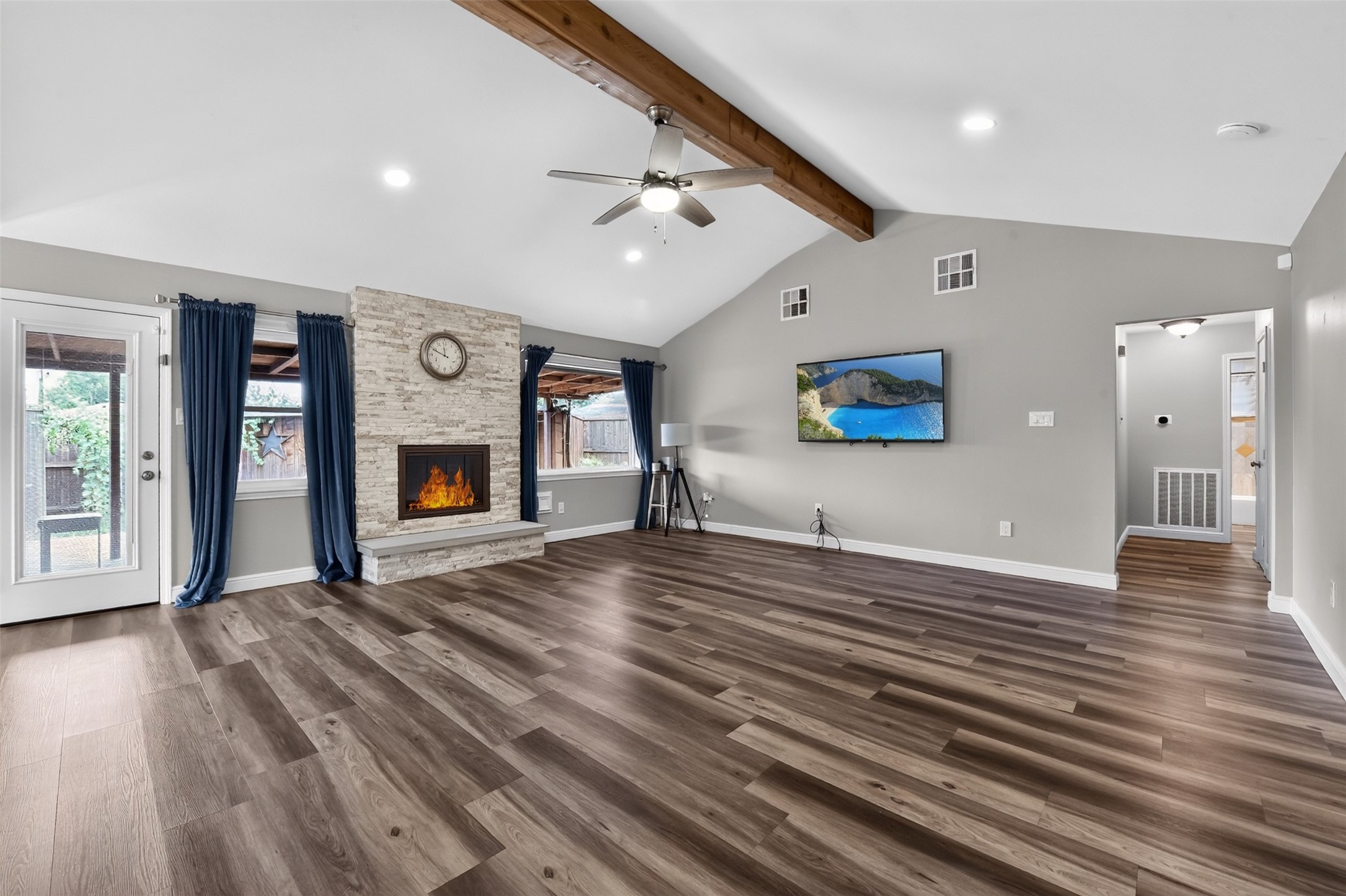 Fireplace and windows overlooking the backyard provide focal point for the living area. Fireplace and windows overlooking the backyard provide focal point for the living area.