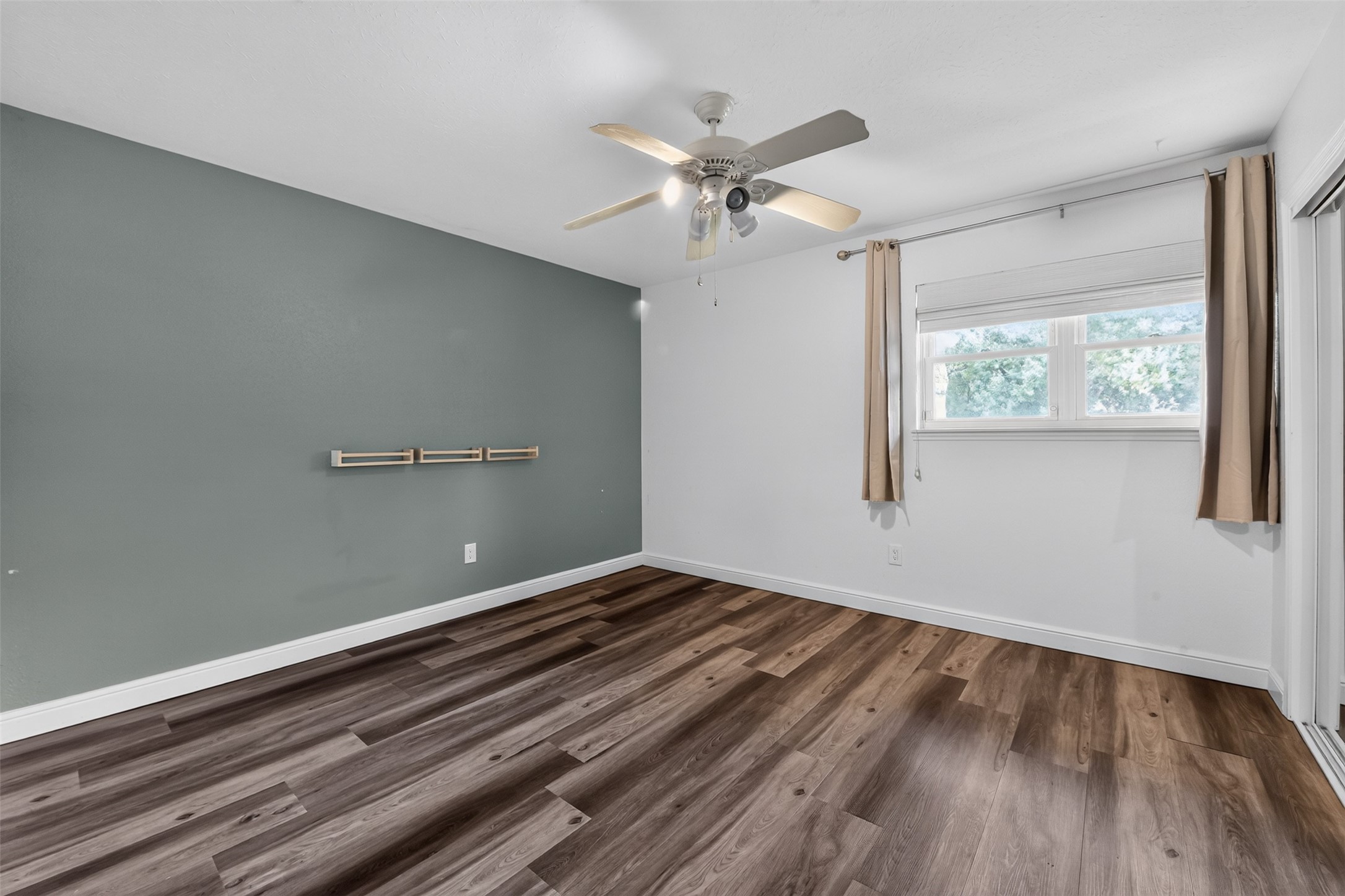 One of two secondary bedrooms...large window with view of the front.