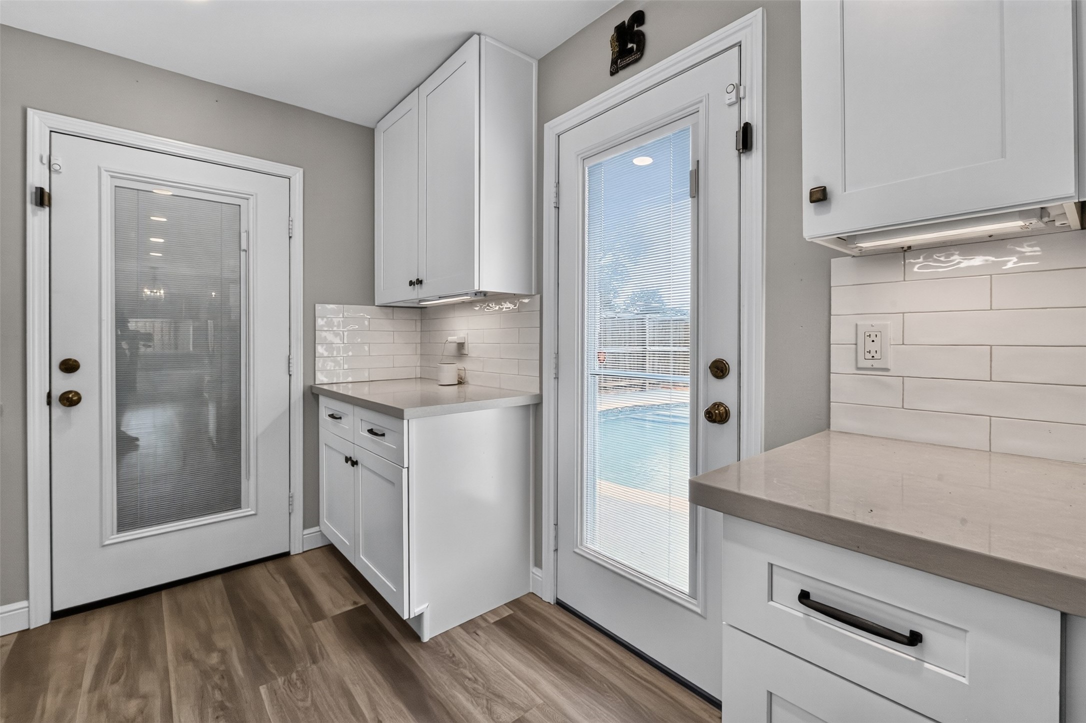 Side door by laundry area leads to the pool.