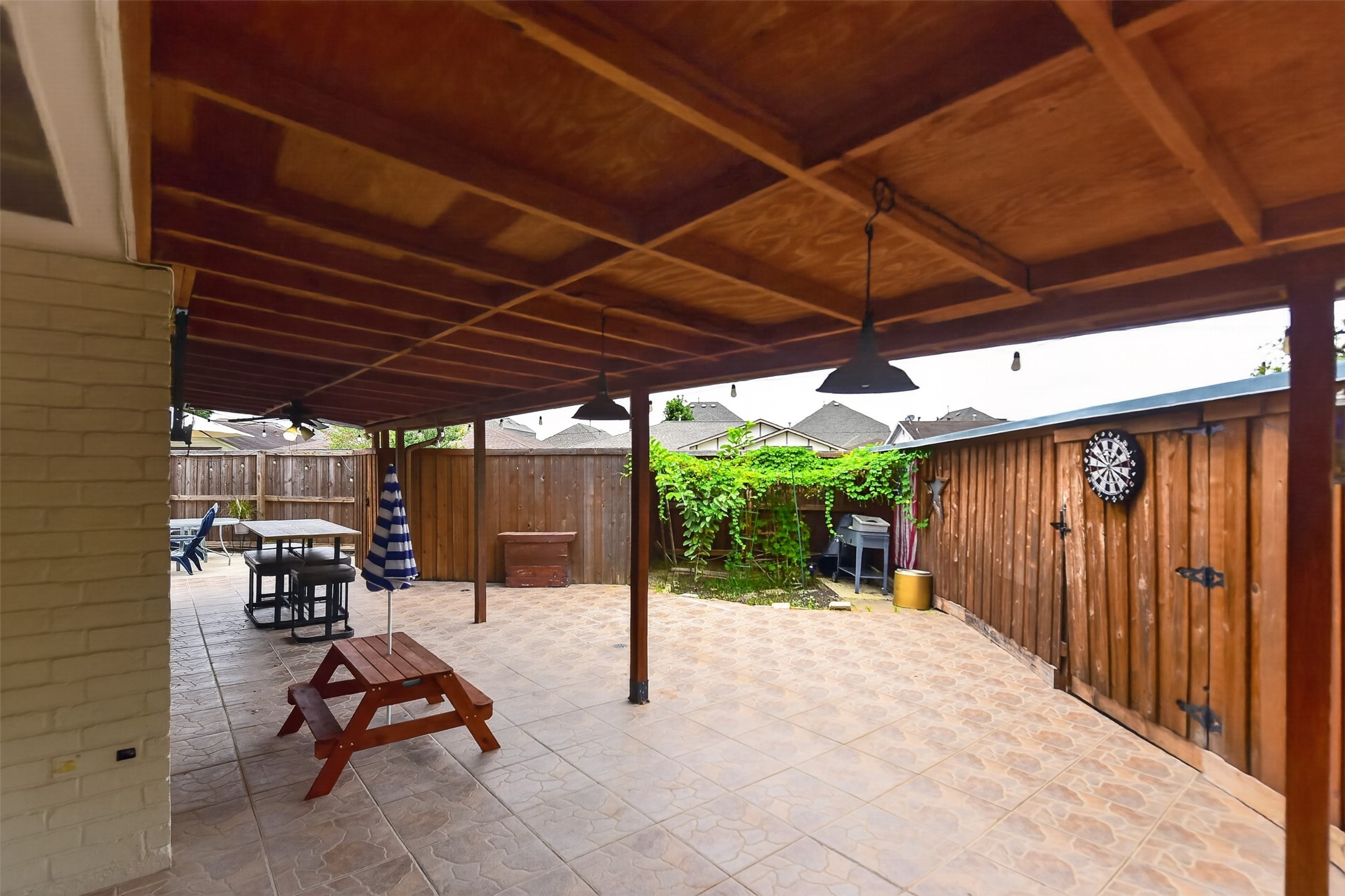 Patio has room for numerous seating and eating areas plus a garden.