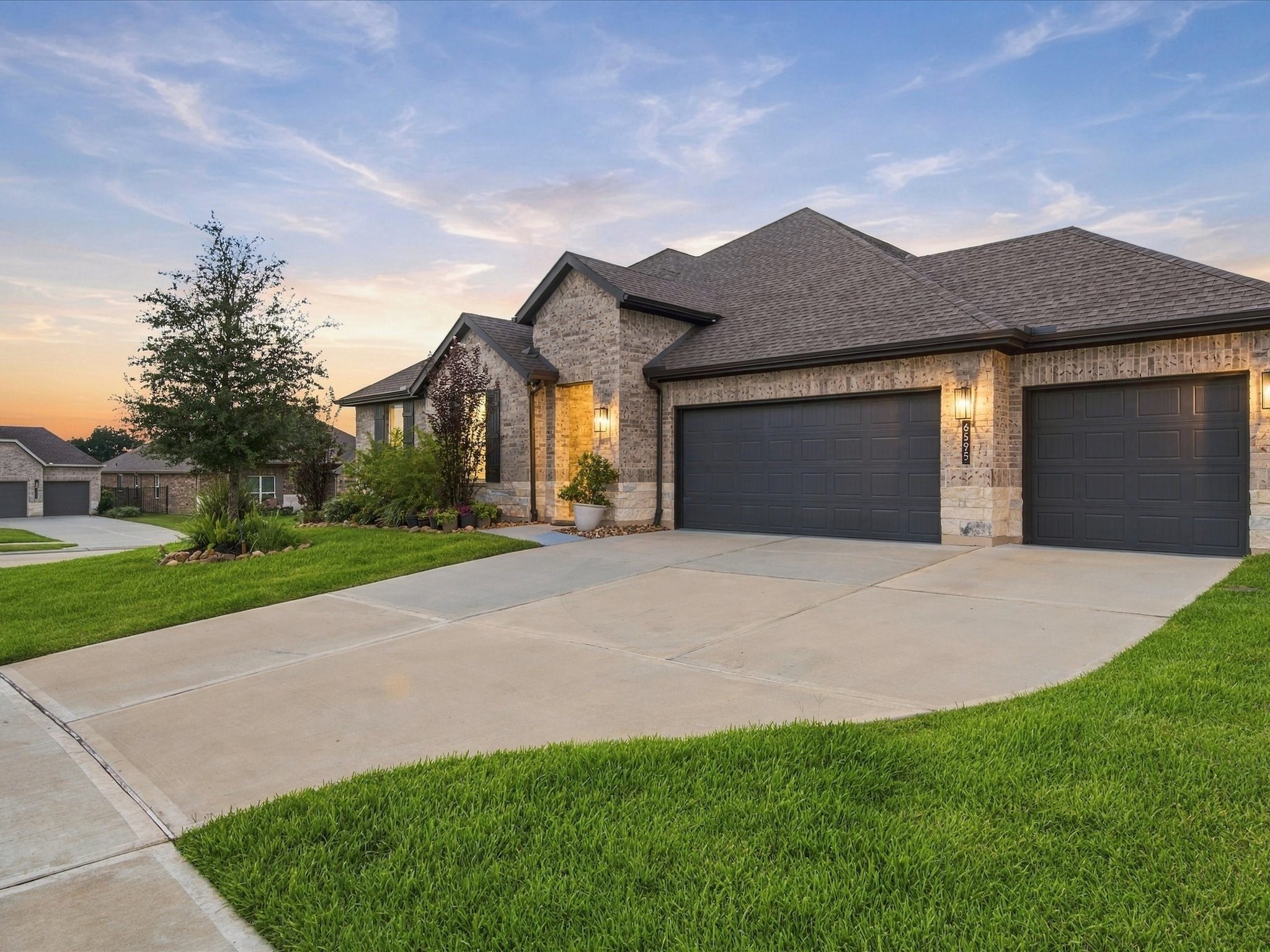3 Car Garage, perfect for extra storage or space for your golf cart. Spacious storage attic included!