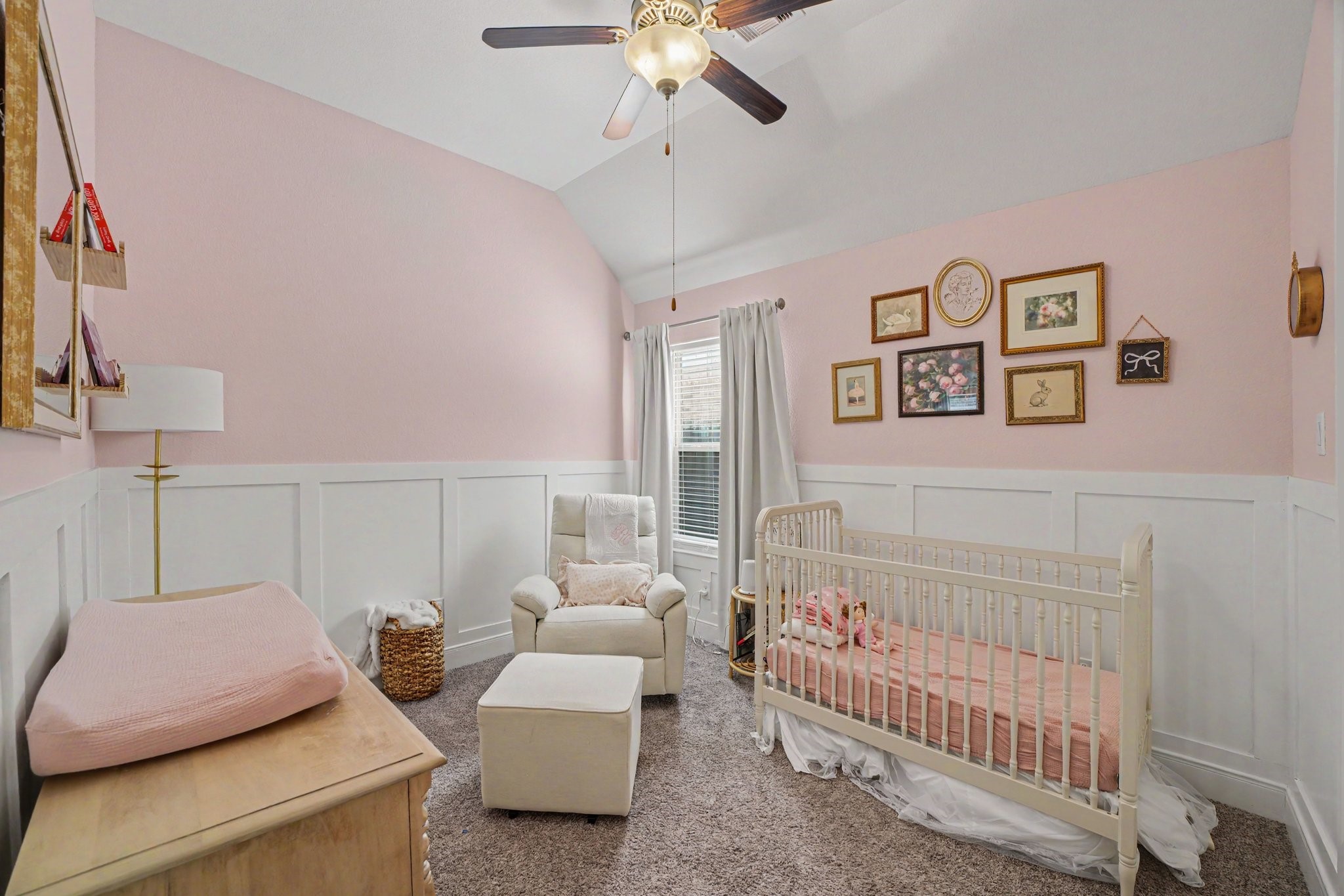 This charming secondary bedroomcurrently styled as a sweet, elegant nurseryoffers a bright and cozy space filled with thoughtful architectural details.