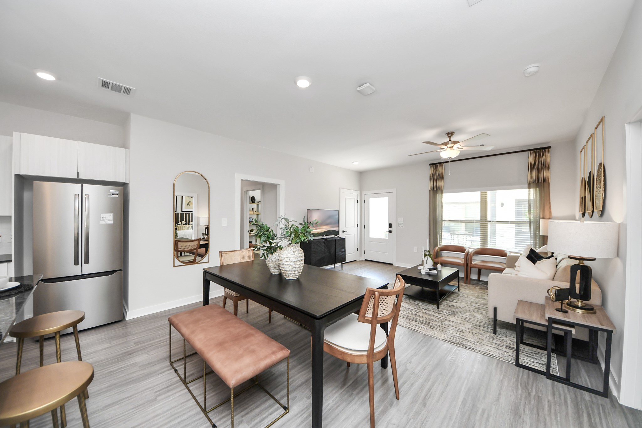 Boasting luxury finishes-stylish Island kitchen,granite counters,subway tile backsplash,ample custom cabinet space,stainless appliances,refrigerator,full size washer&dryer included,wood-like flooring throughout,open concept floor plan.