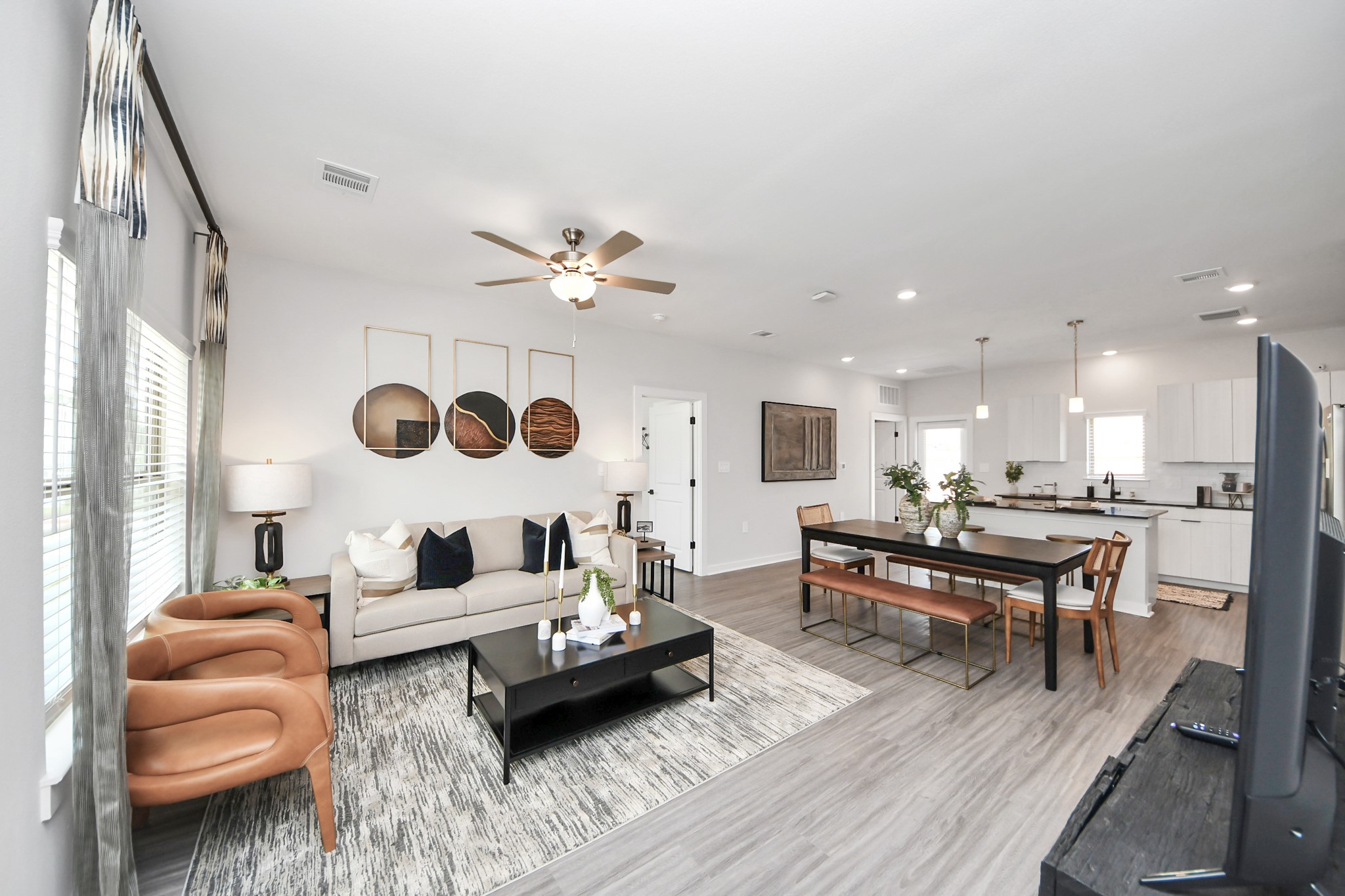 Boasting luxury finishes-stylish Island kitchen,granite counters,subway tile backsplash,ample custom cabinet space,stainless appliances,refrigerator,full size washer&dryer included,wood-like flooring throughout,open concept floor plan.