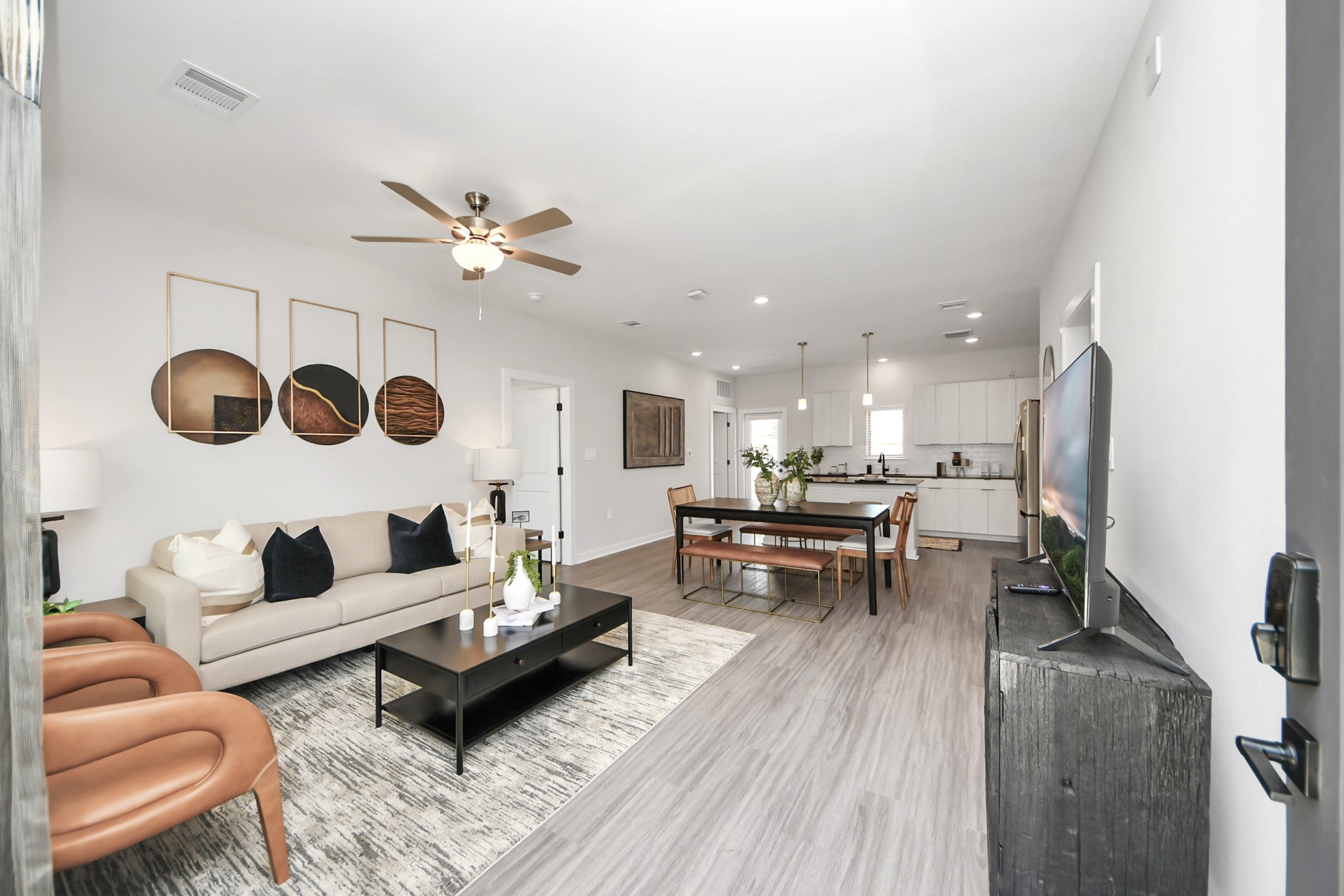 Boasting luxury finishes-stylish Island kitchen,granite counters,subway tile backsplash,ample custom cabinet space,stainless appliances,refrigerator,full size washer&dryer included,wood-like flooring throughout,open concept floor plan.