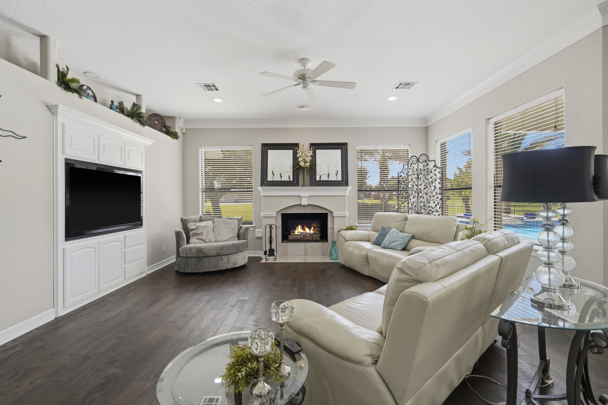 Main living area featuring fireplace and backyard views