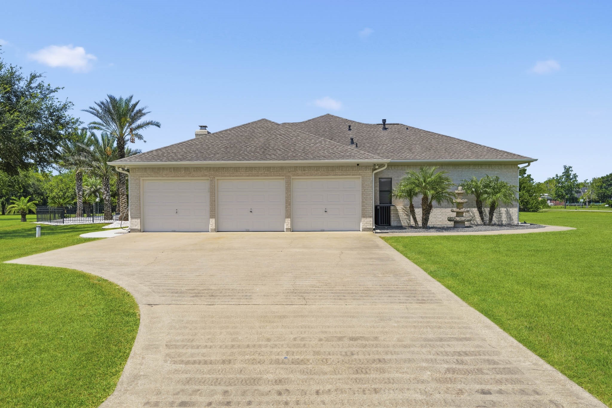 Generous driveway leading to the attached garage 3 Car Garage