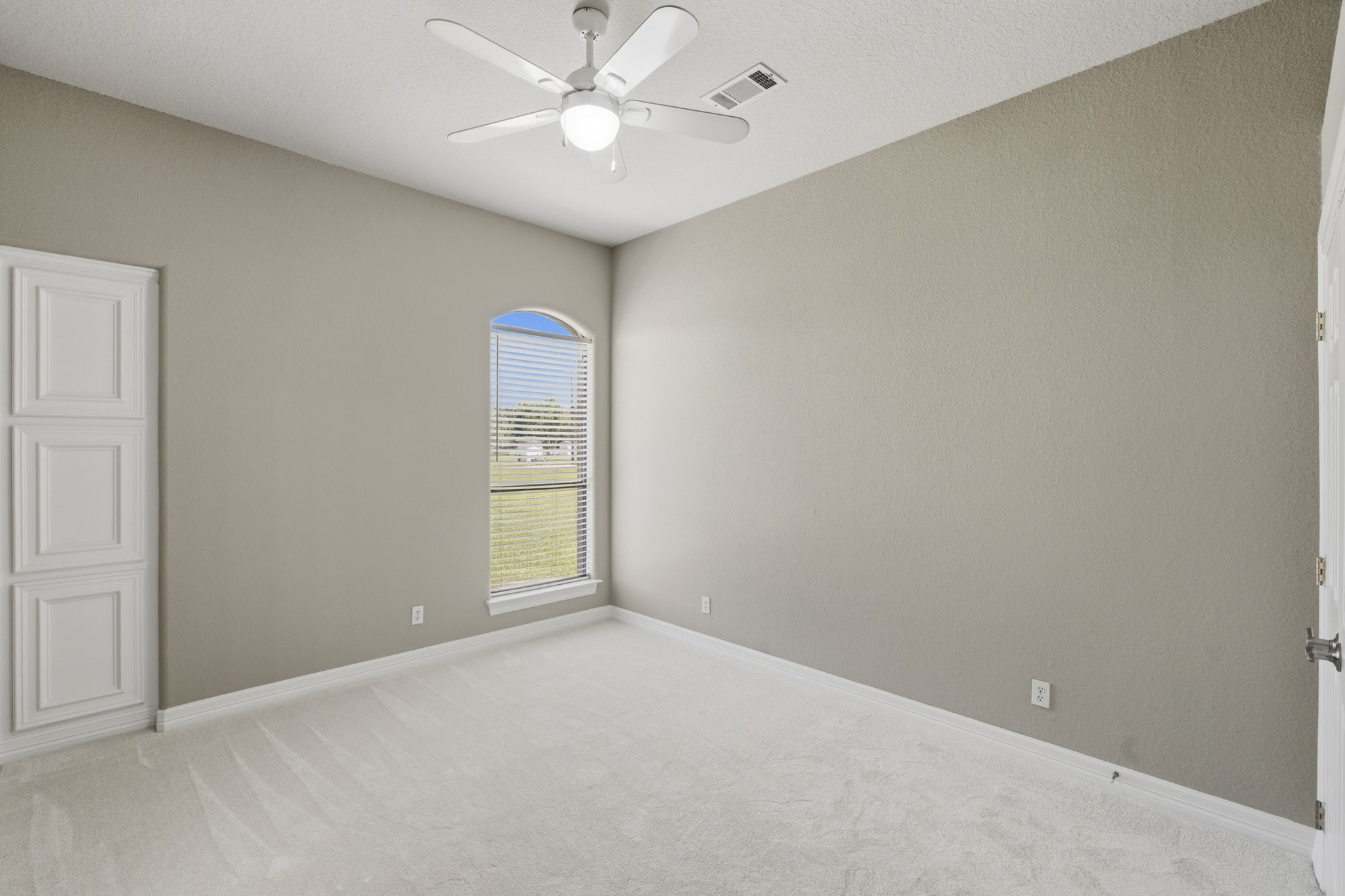 Spacious secondary bedroom with natural light