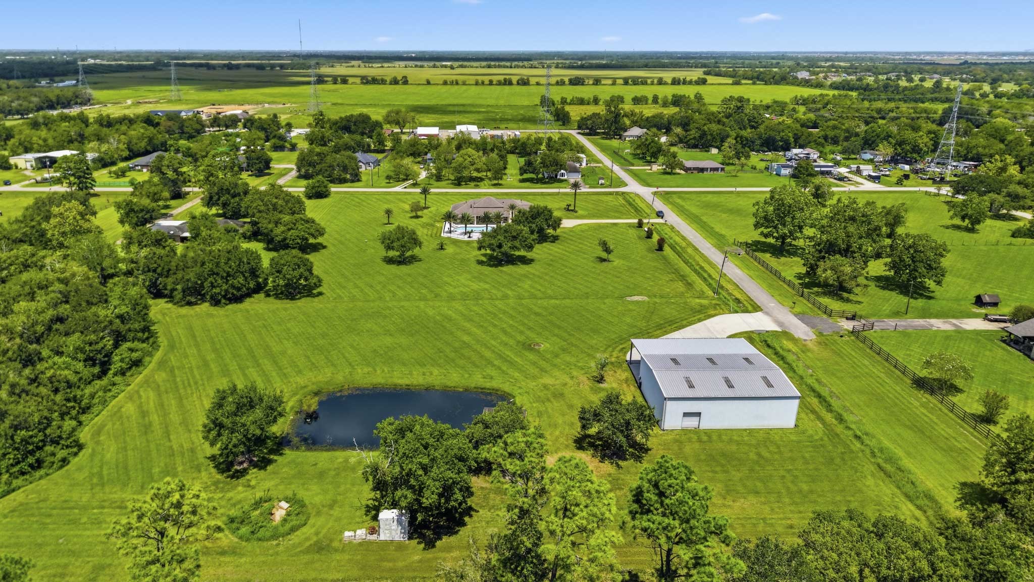 Rear aerial view showcasing the home's impressive setting
