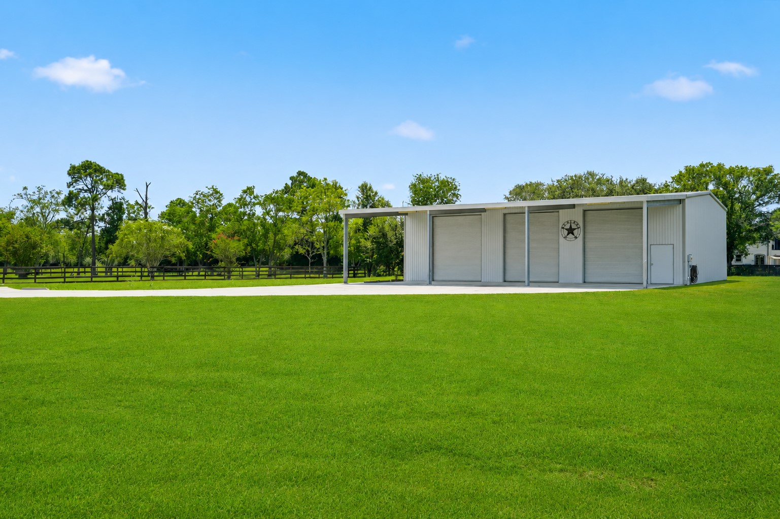 Large detached shop with expansive lawn
