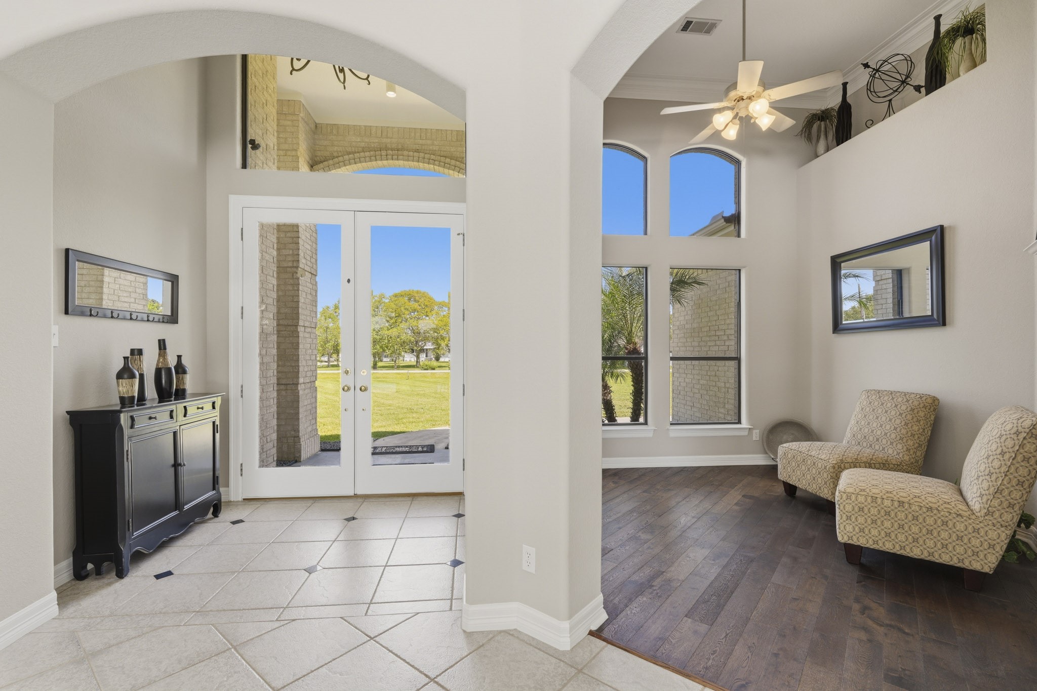 Spacious foyer featuring high ceilings and custom architectural details