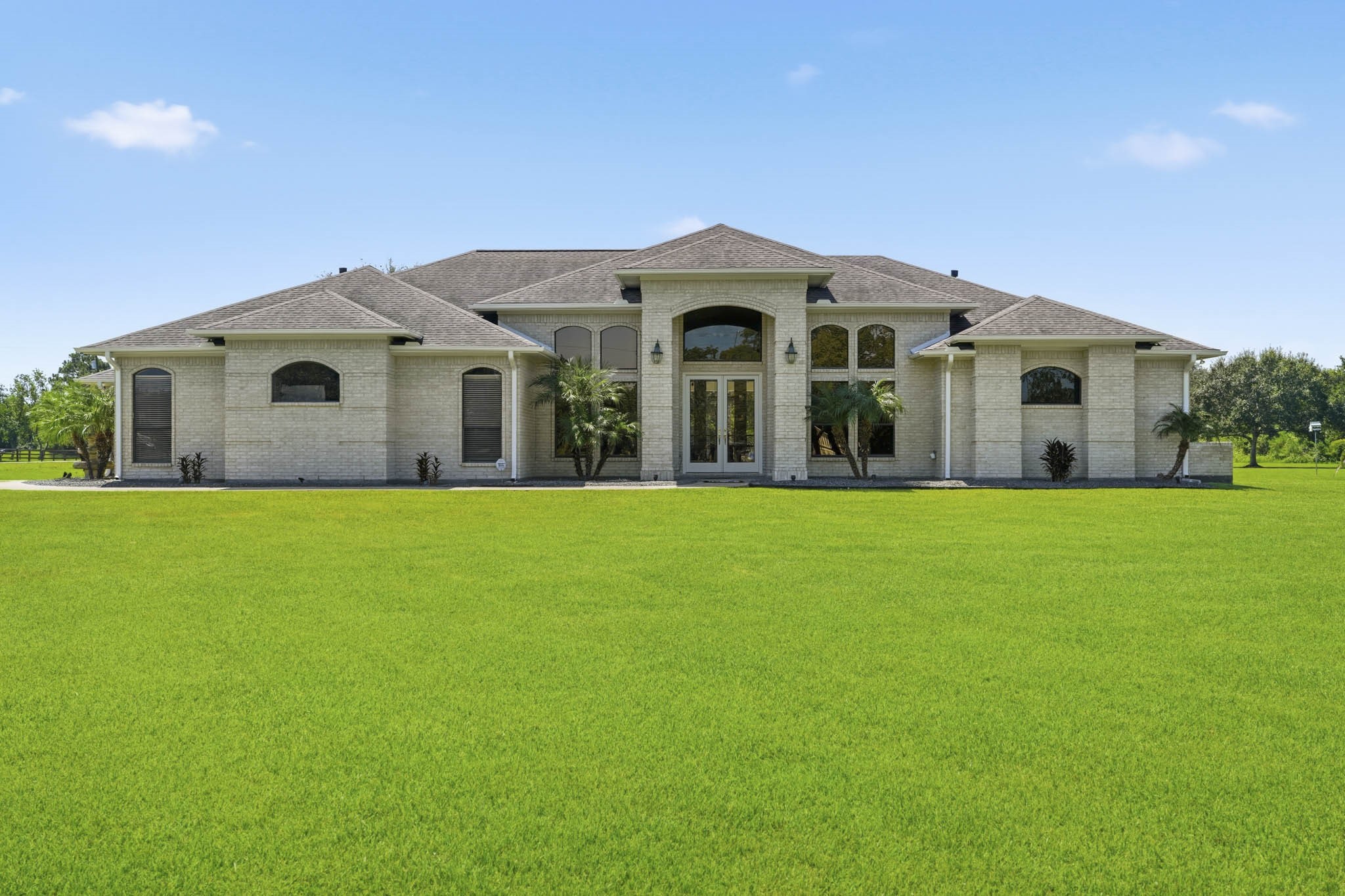 Impressive front elevation with expansive manicured lawn
