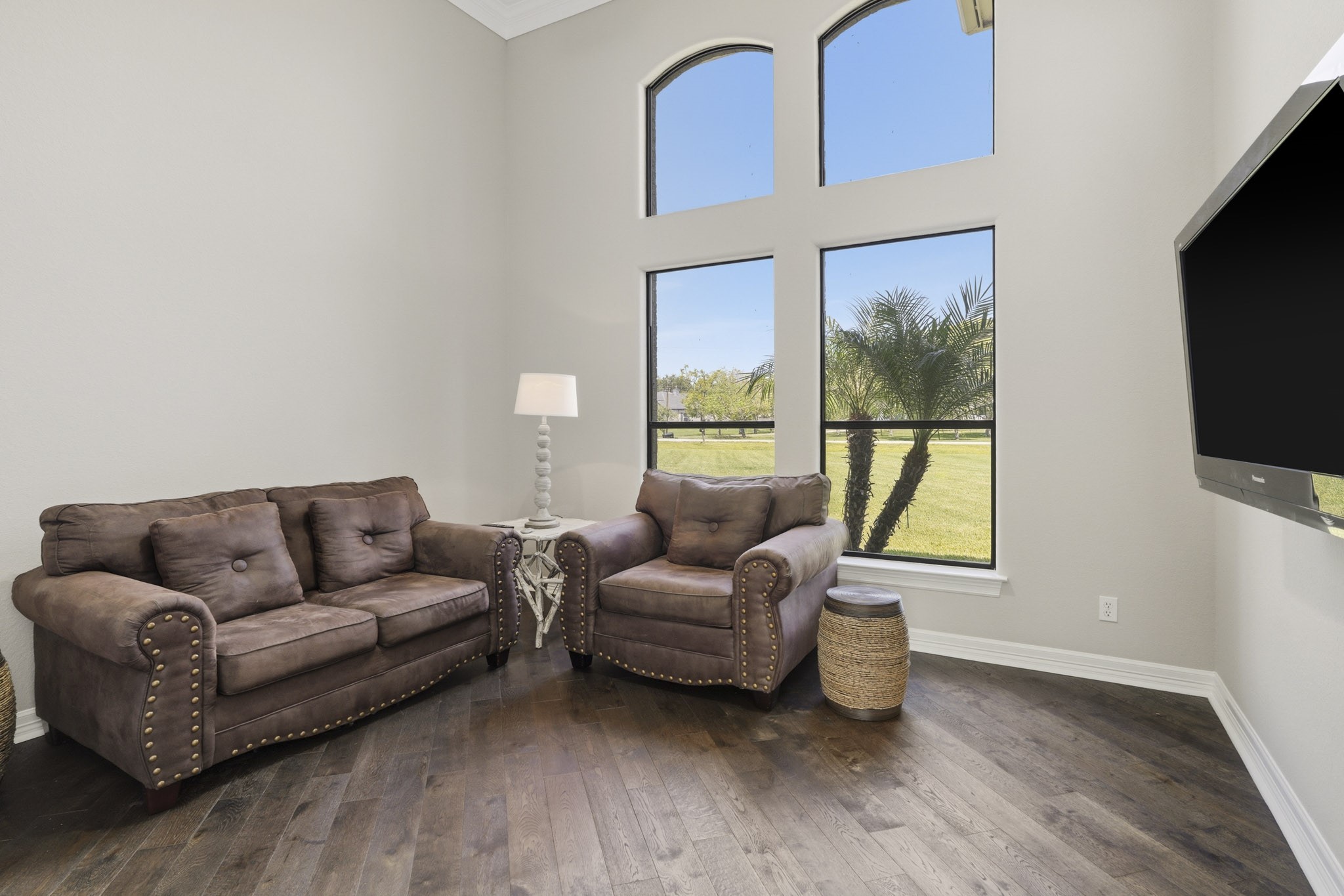 Comfortable secondary living area with tall windows