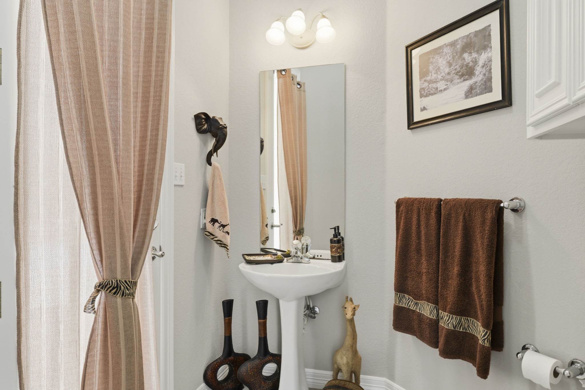 Conveniently located guest powder bath