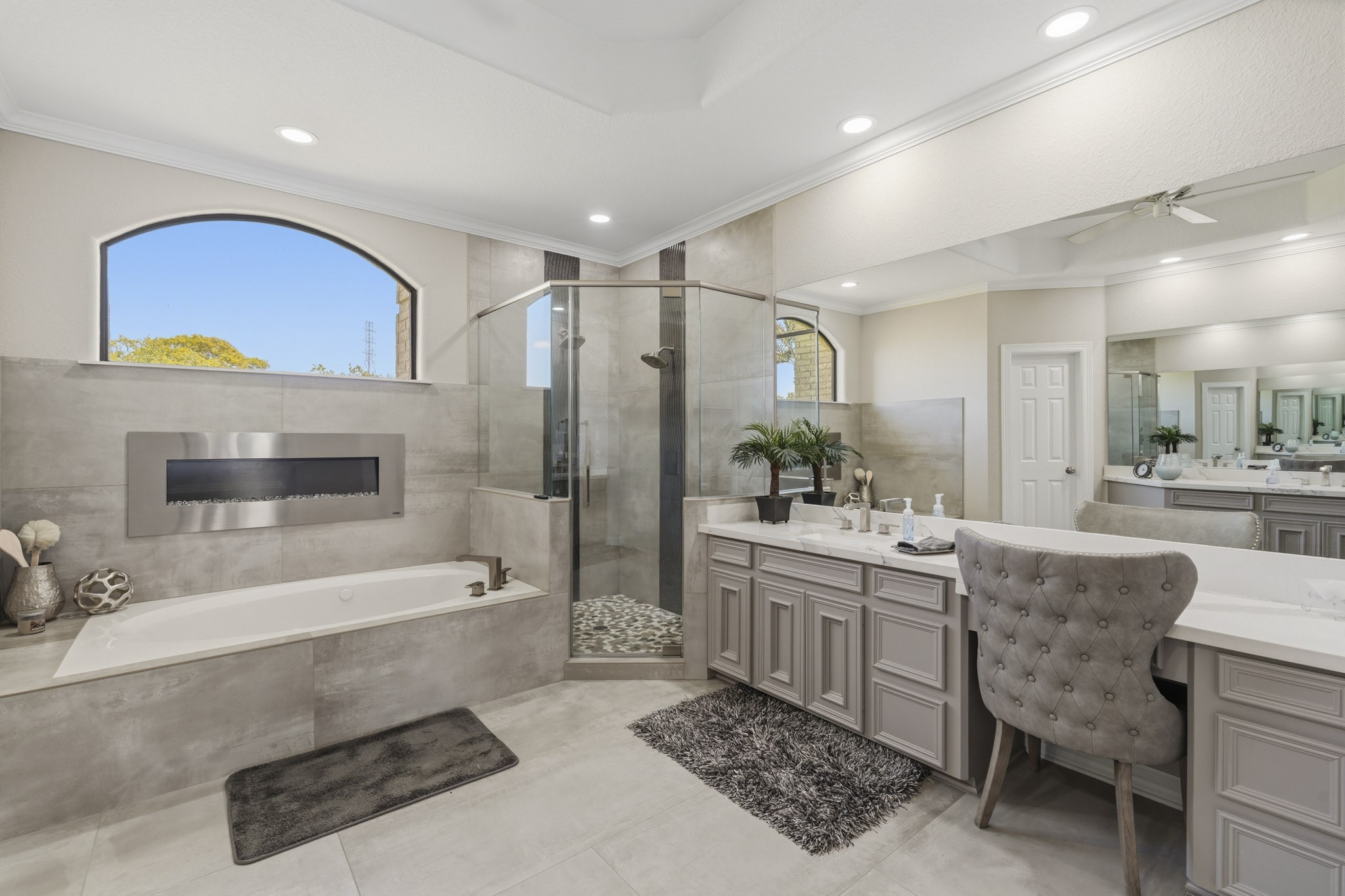 Oversized primary bath with extensive vanity and storage space