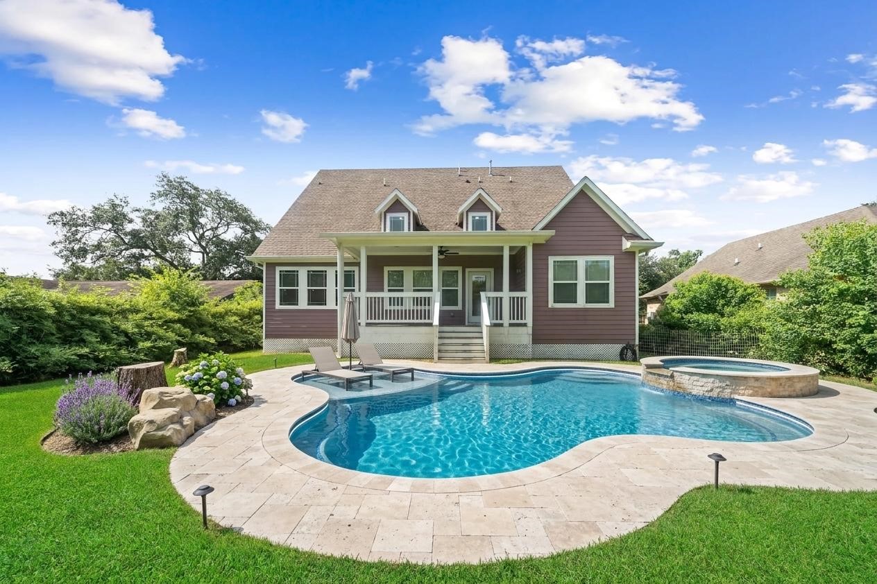 Virtually staged backyard with pool and spa.