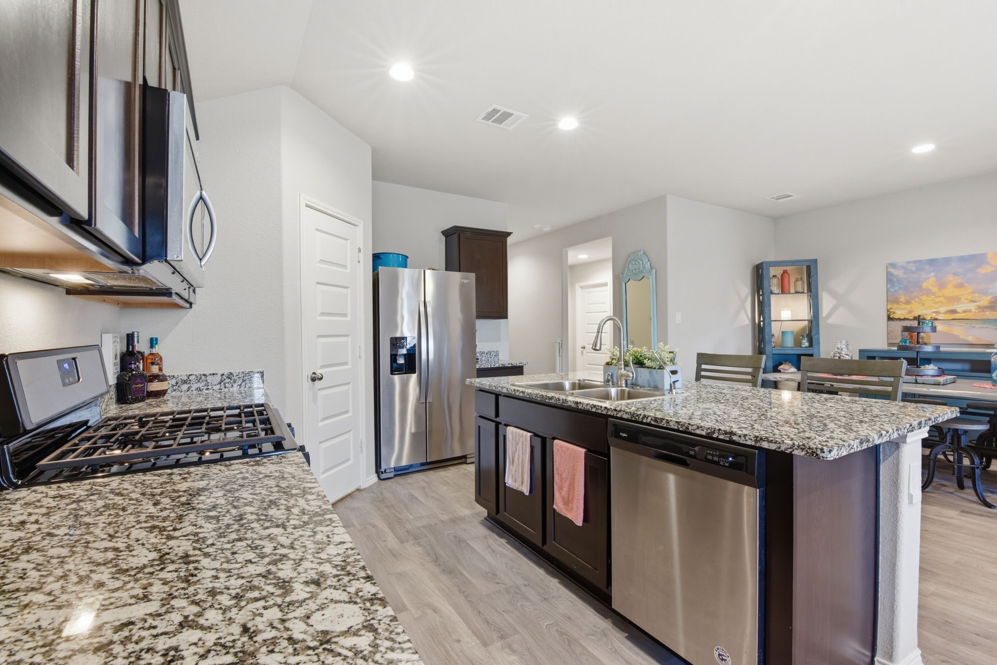 Equipped with gas cooktop, microwave, dishwasher, and energy-efficient appliances.