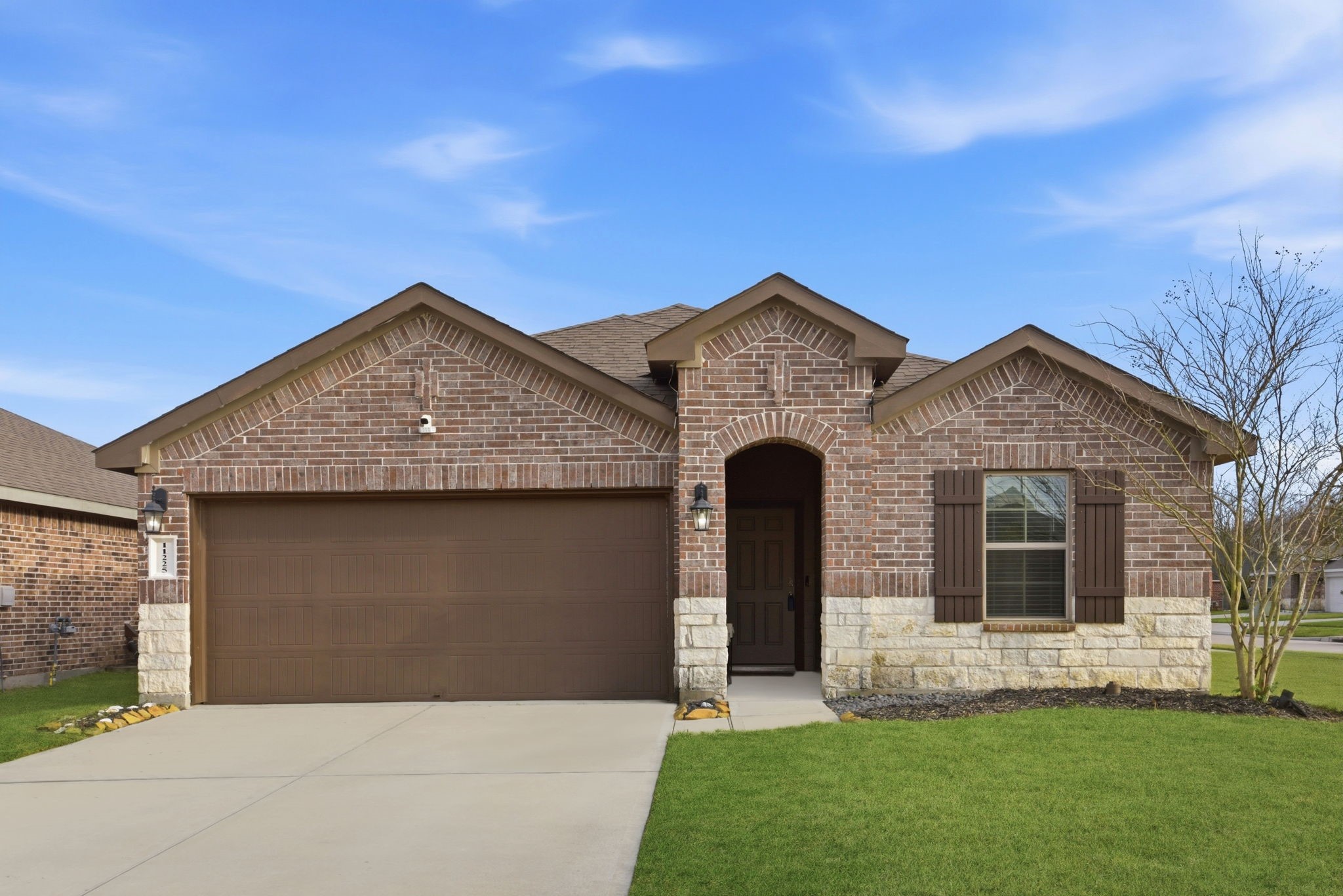 Spacious double-wide driveway with attached 2-car garage in desirable subdivision.