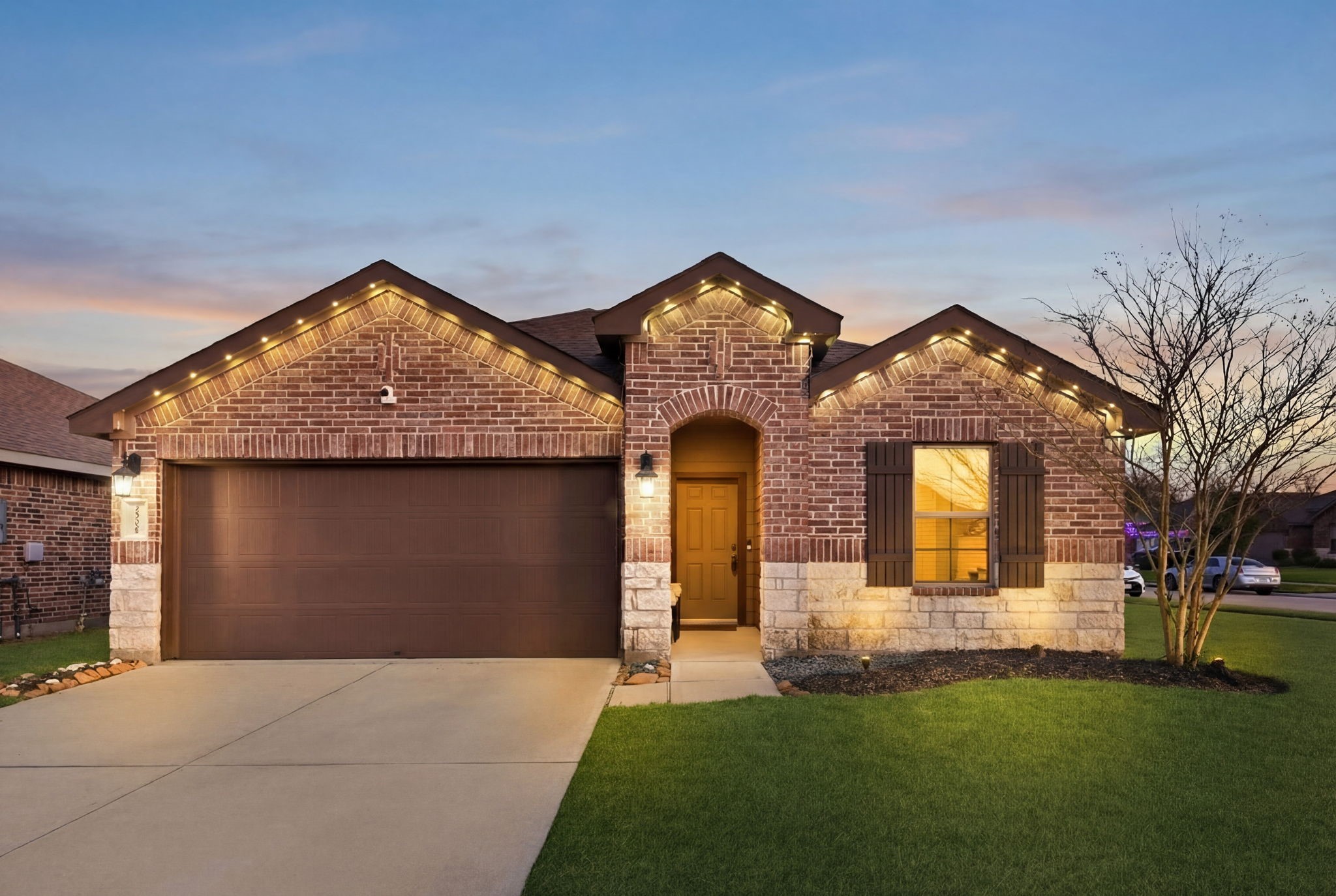 Move-in ready home with outdoor night lighting enhancing ambiance and security.