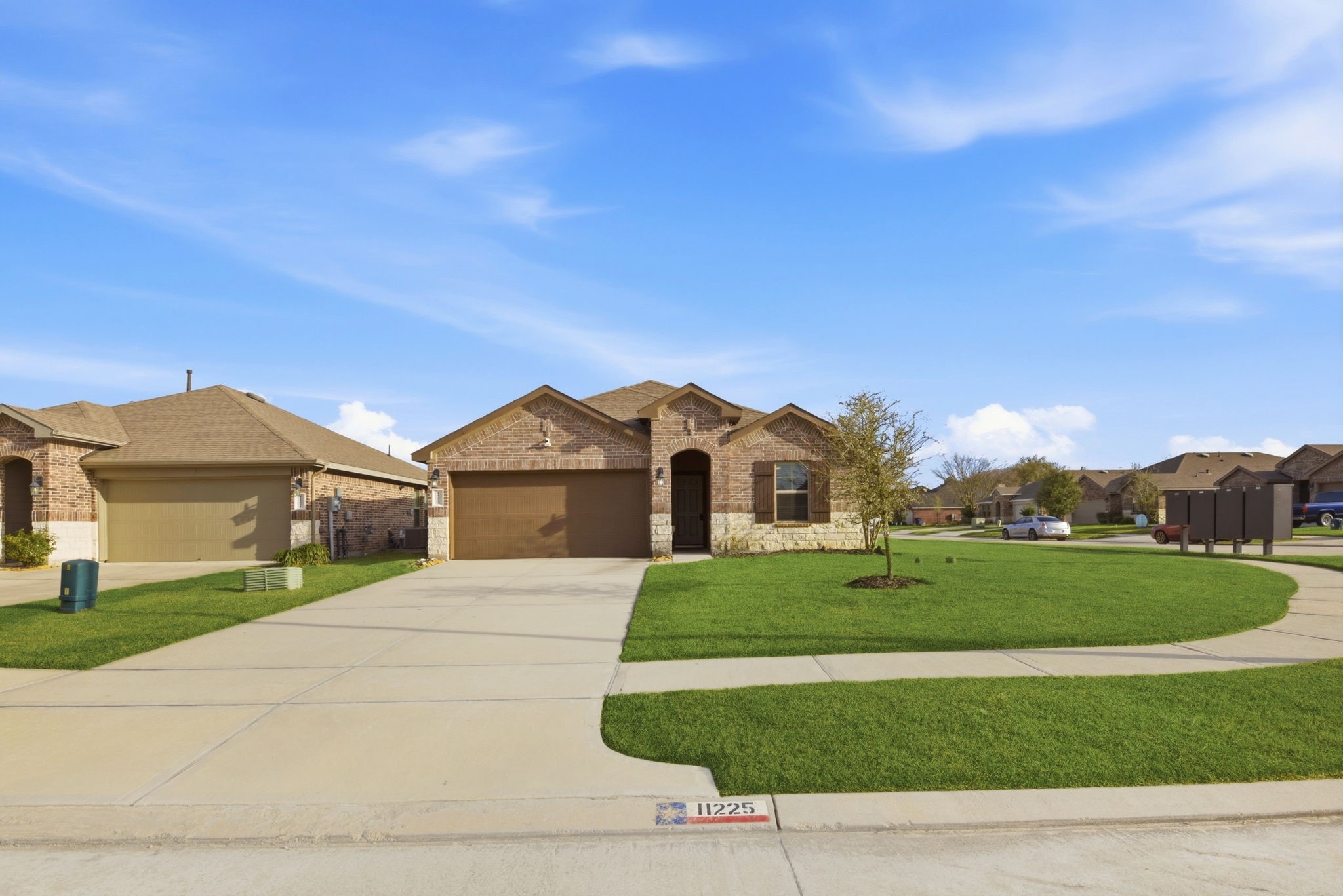 Texas City TX home for sale  stunning modern one-story exterior with stone, brick and excellent curb appeal.