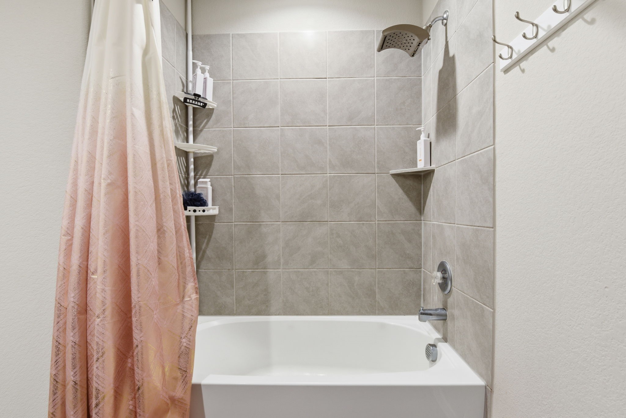 Convenient full bathroom easily accessible from secondary bedrooms.