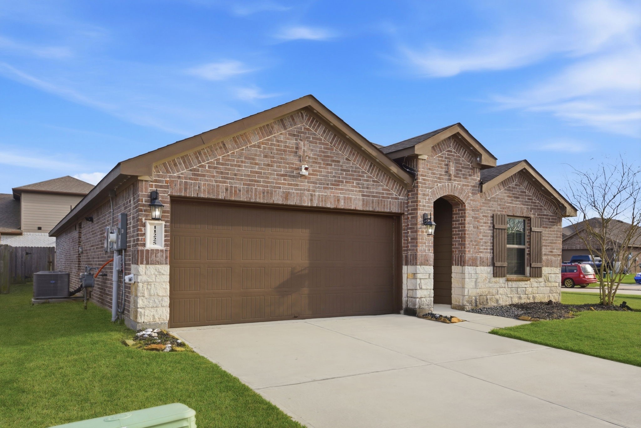 Attractive front elevation with well-maintained landscaping and clean design.