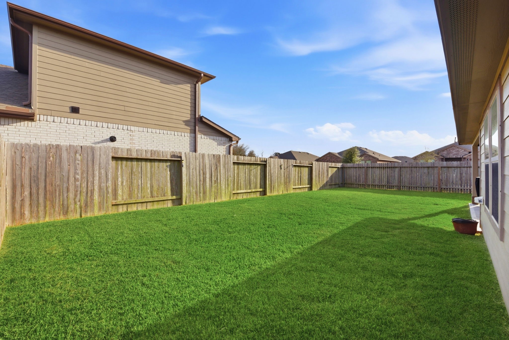 Spacious yard with room for pets, play, or gardening.