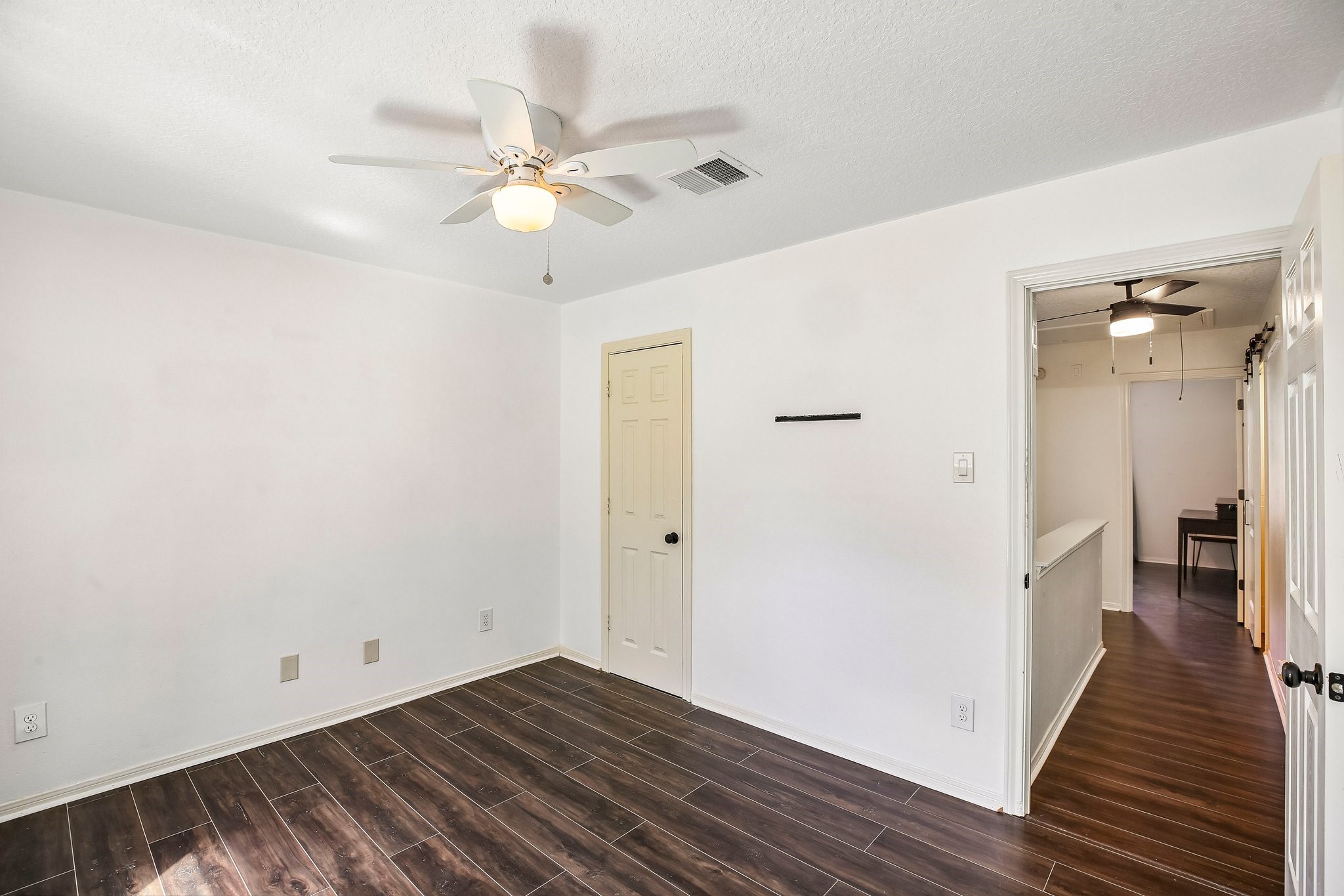 Upstairs bedrooms are on opposite ends fof the hallway for added privacy.