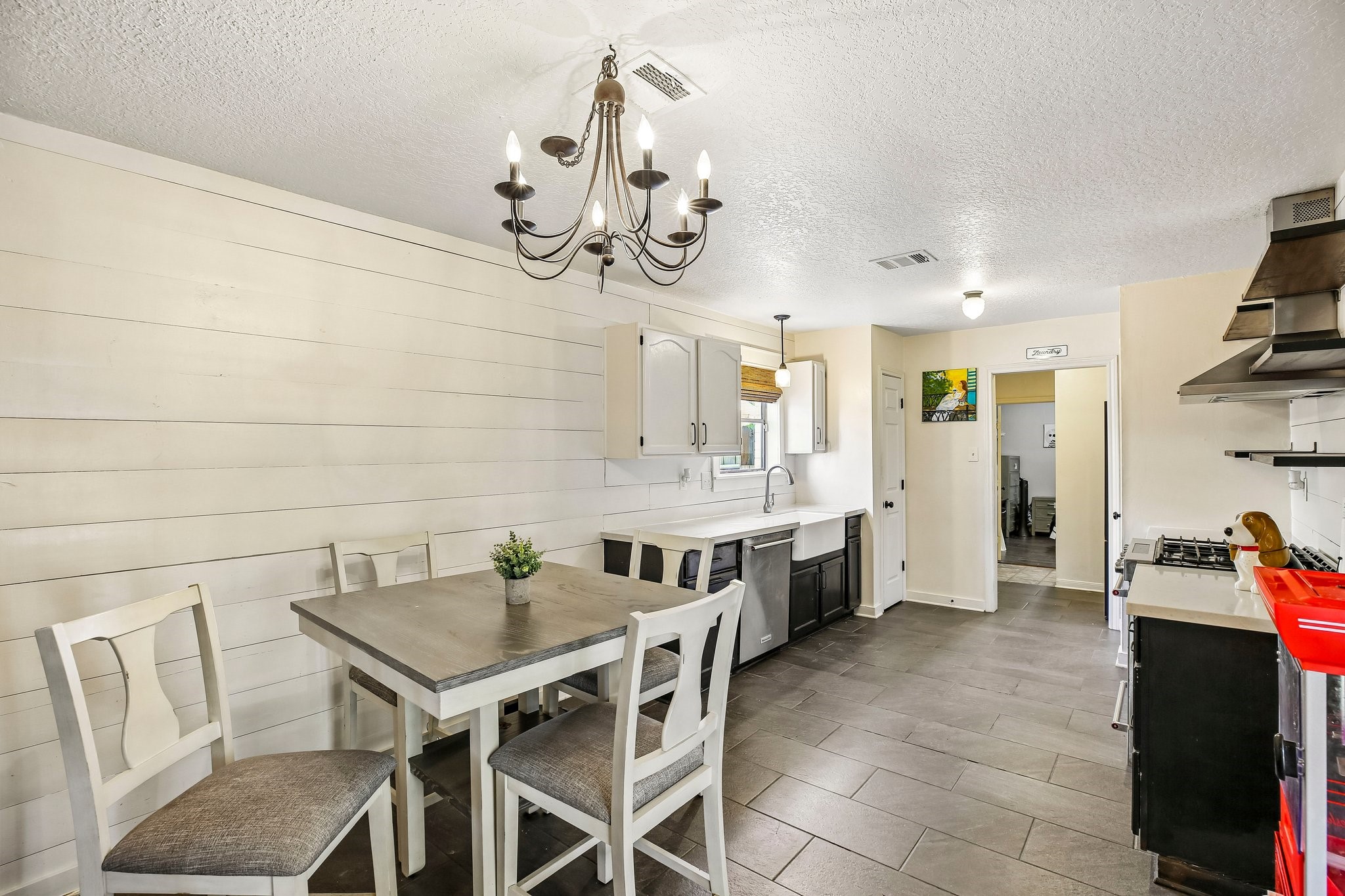 The kitchen features two pantries and tile flooring.