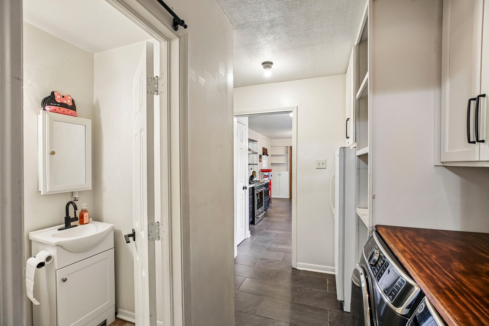 A convenient half-bath is situated off of the laundry room.