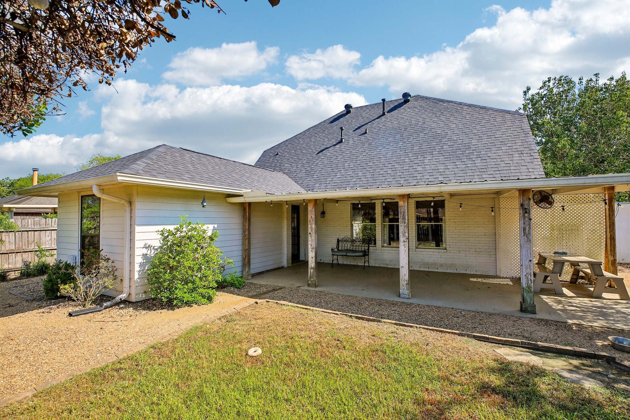 The spacious backyard is ideal for entertaining with it's large covered porch, additional pergola and lawn space.