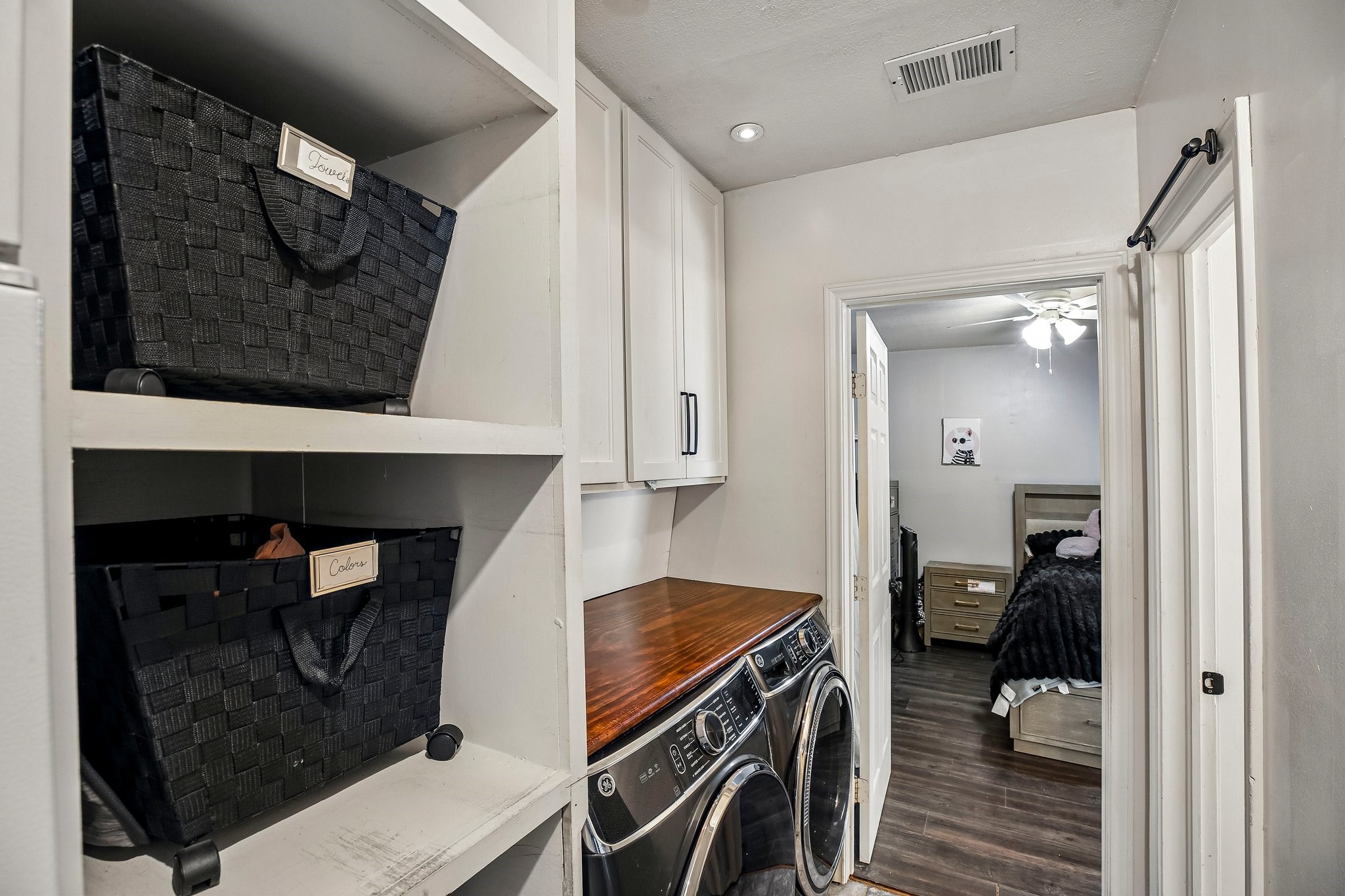 Laundry room with plenty of storage.