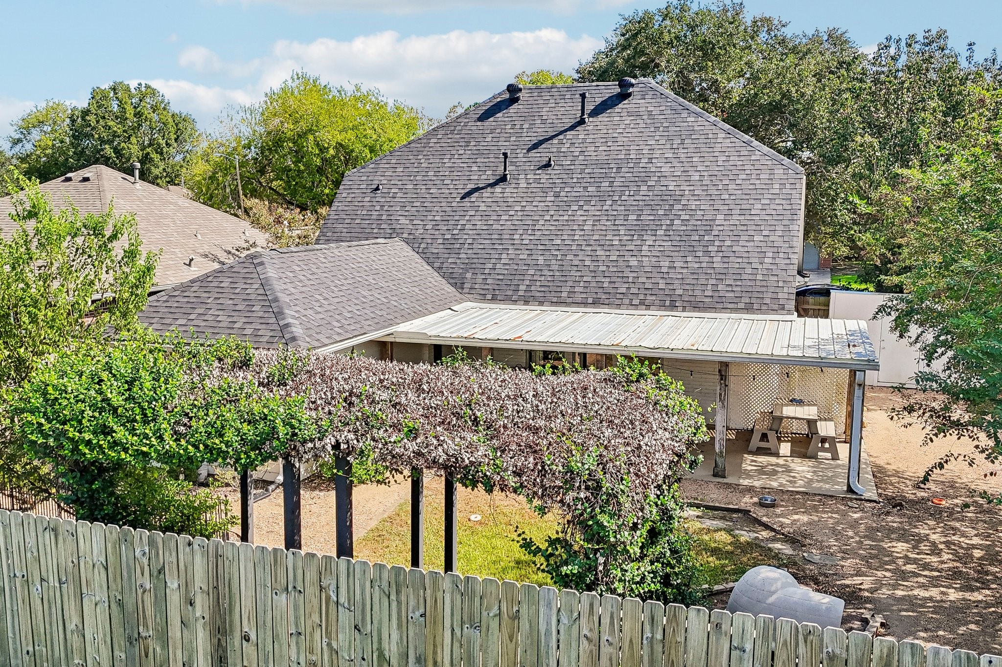 Pergola at the rear of the backyard for additional seating.