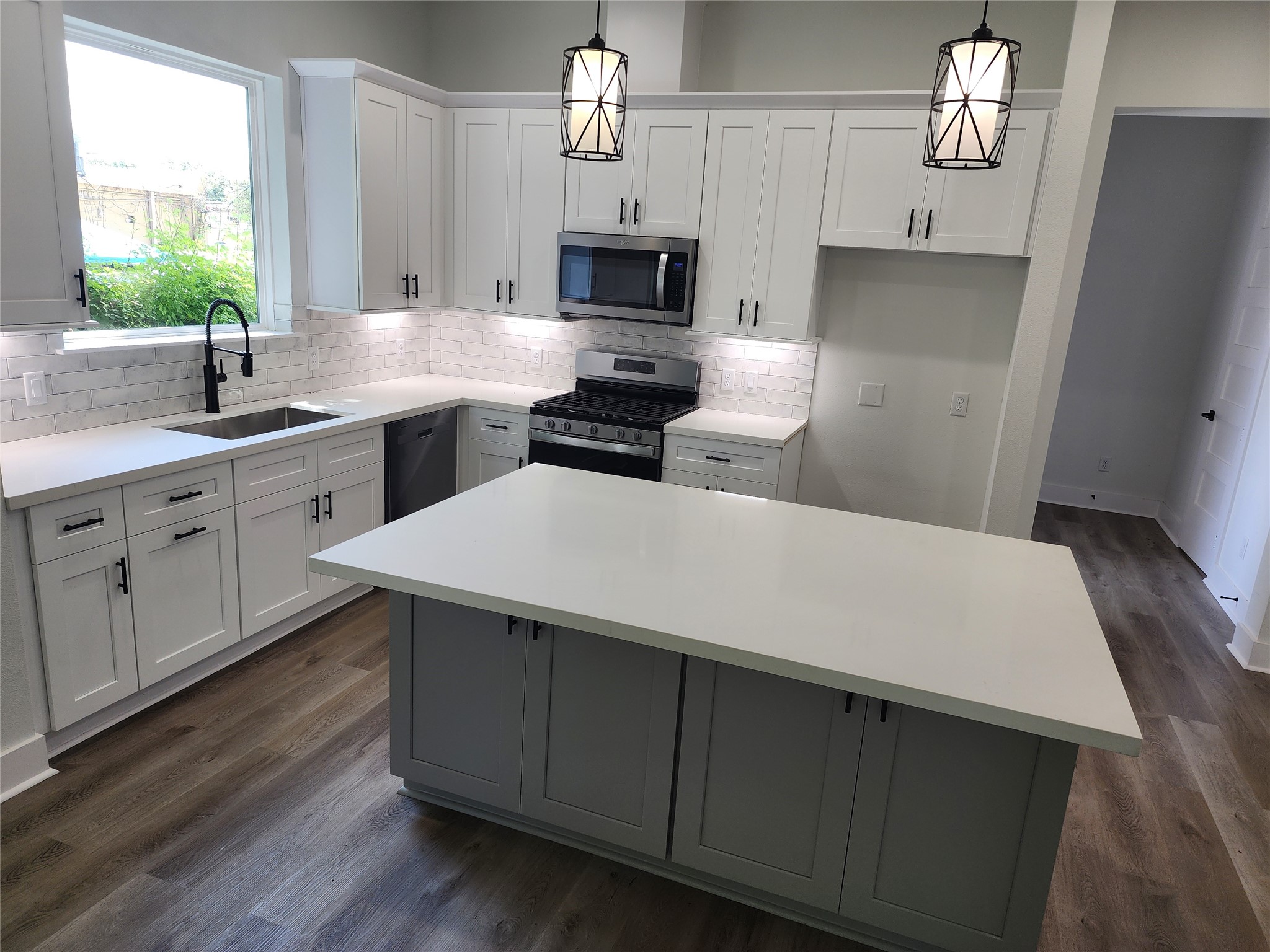 Elegant kitchen featuring sleek cabinetry with soft-close doors and drawers.