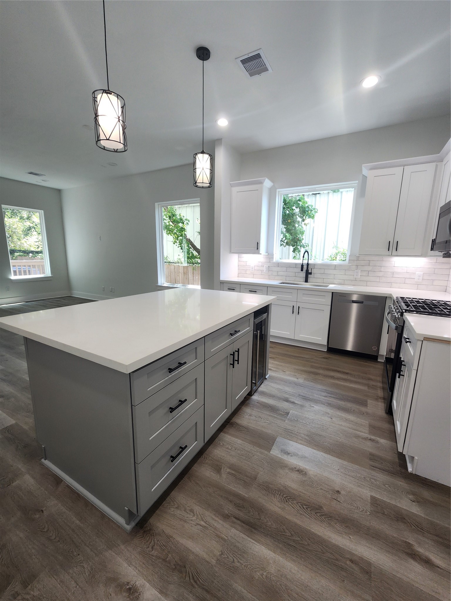 Ample storage in the sleek kitchen island enhances functionality and style.