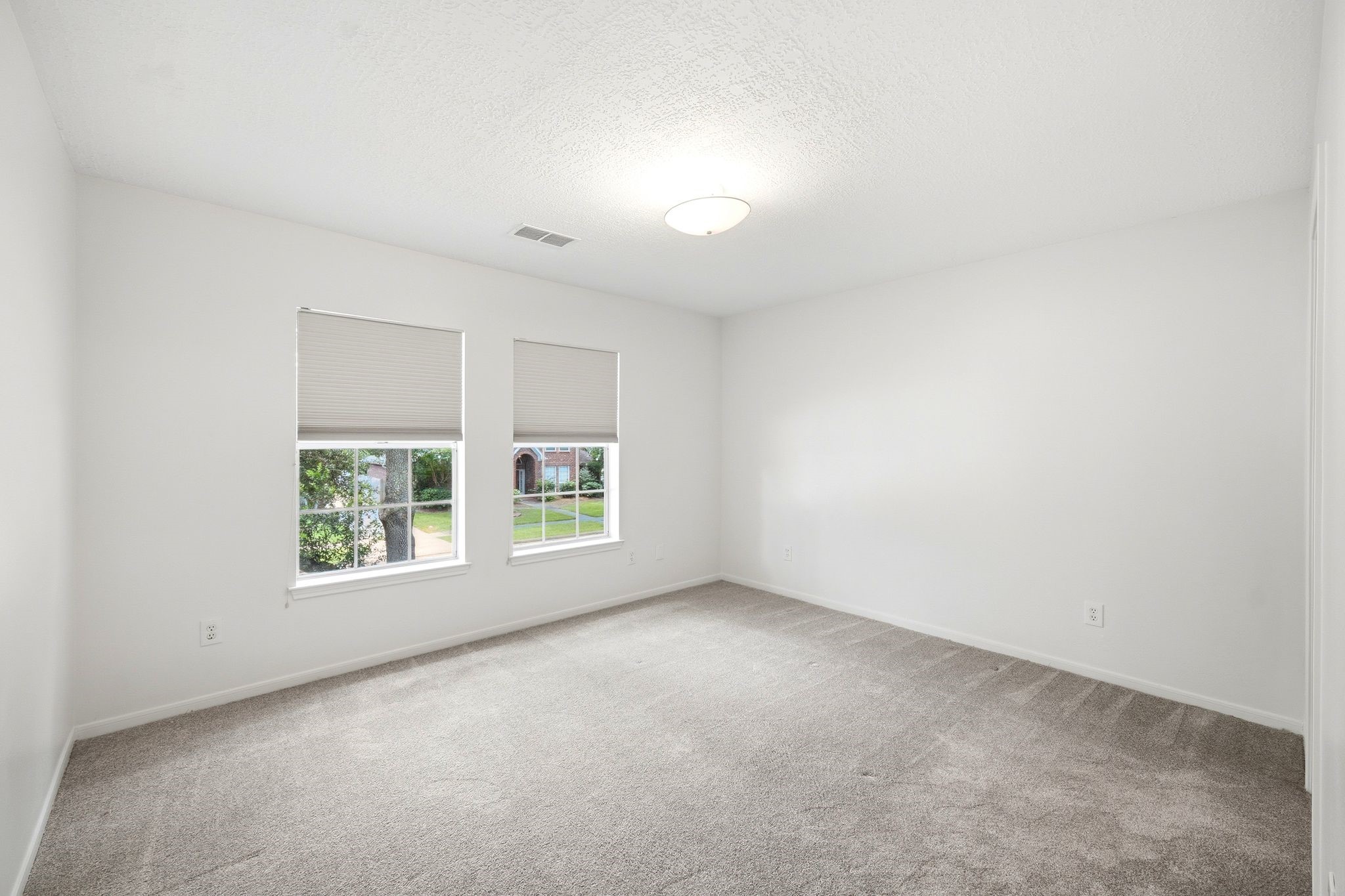 Bright and spacious, this unstaged fourth bedroom offers a blank canvas to create your ideal retreat.