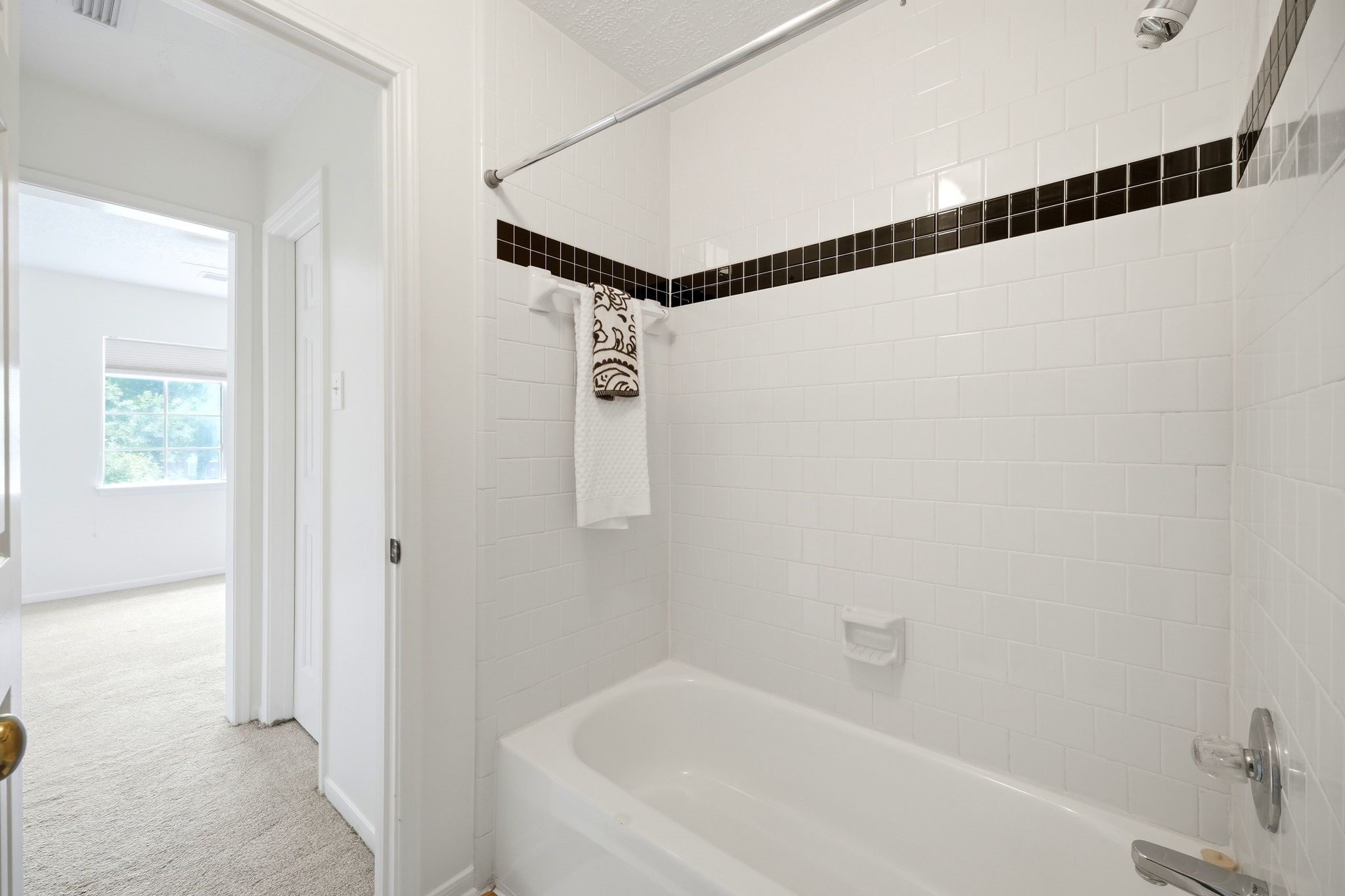Experience seamless convenience with a Jack-and-Jill bathroom that features a stylish tub/shower combo, perfect for shared living.