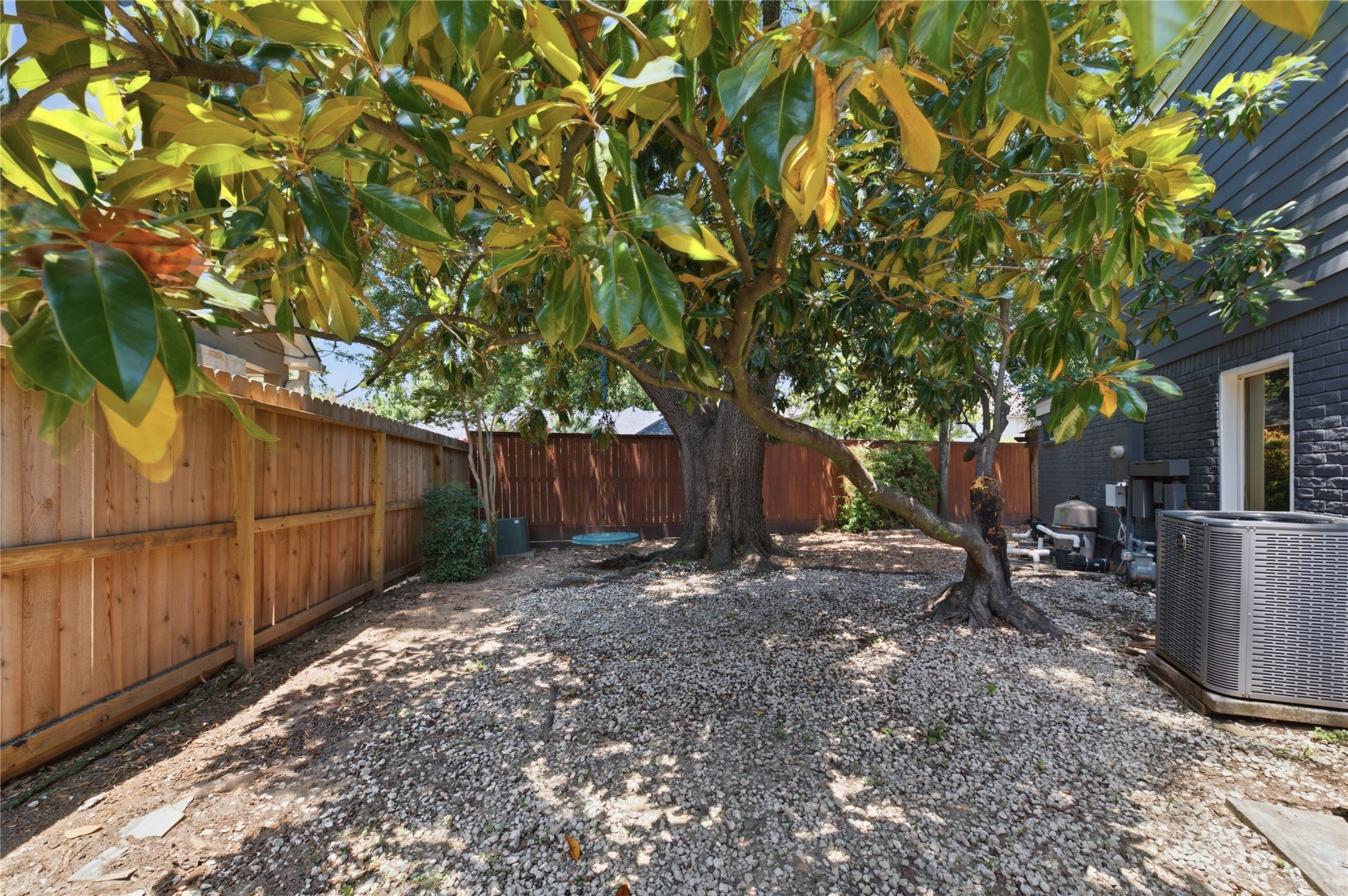 Fully fenced yard offers privacy and tranquility.