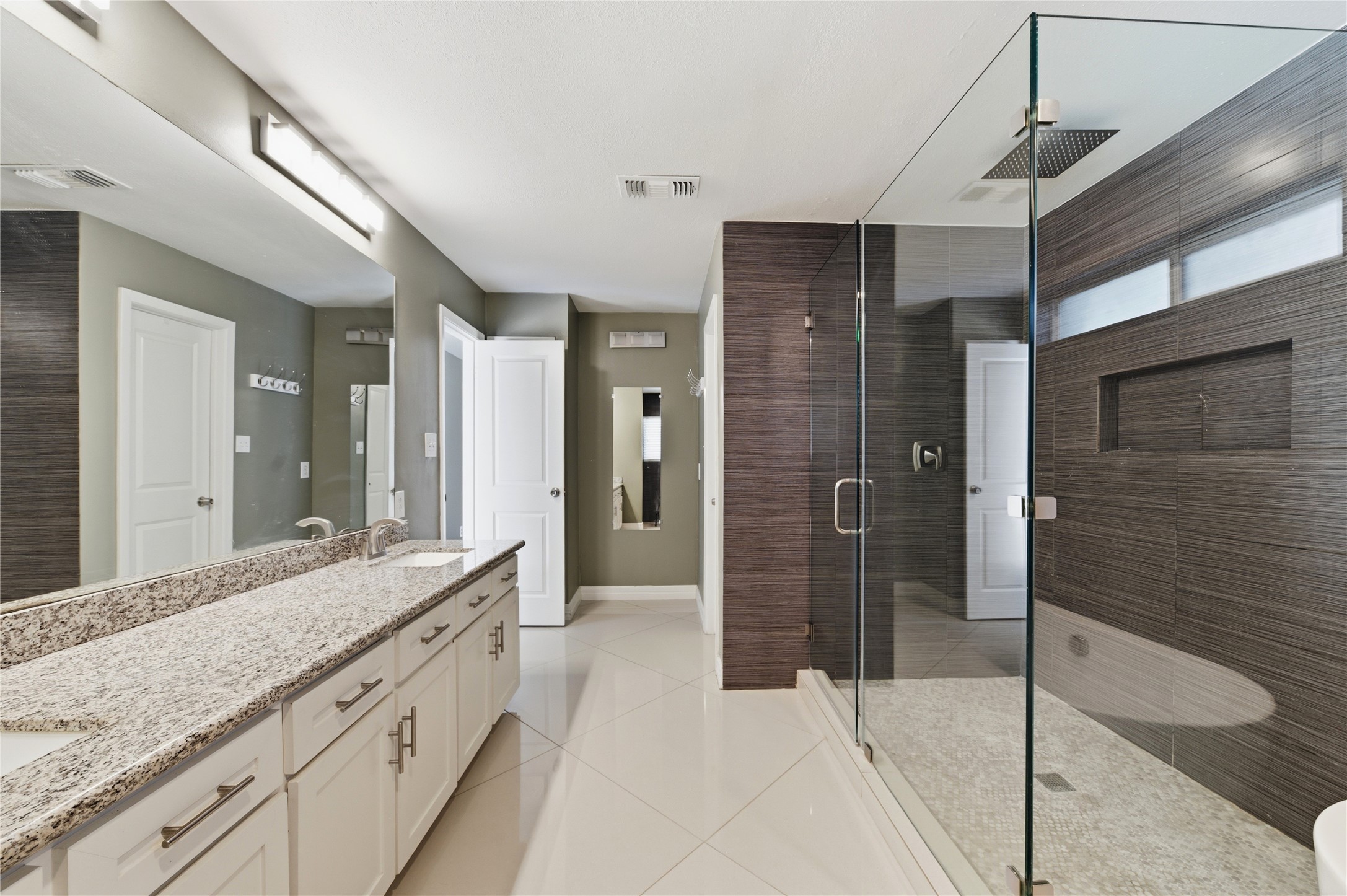 Expansive dual-sink vanity with abundant storage.