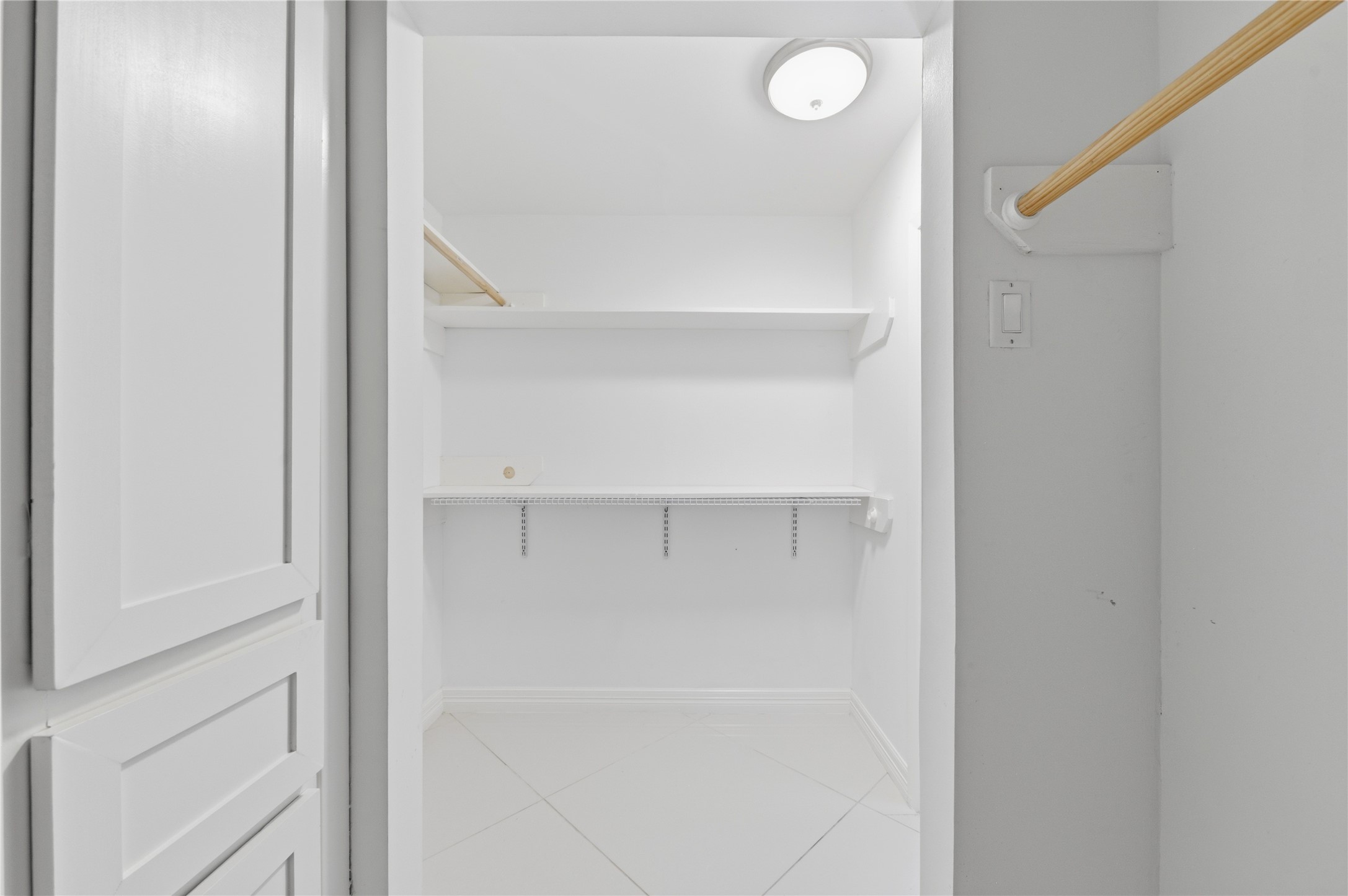 Primary bedroom walk-in closet.