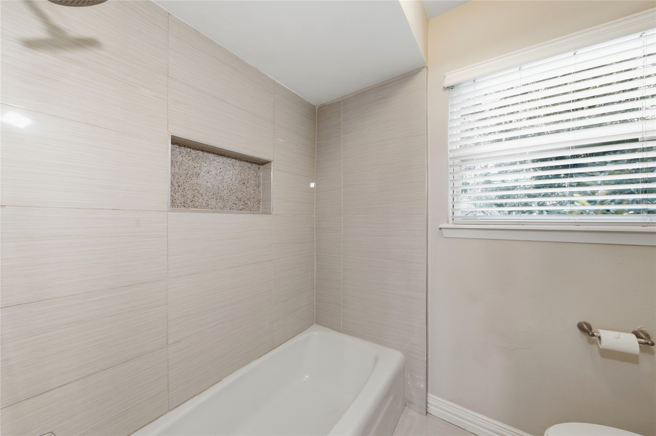 Thoughtfully updated guest bathroom with modern fixtures.