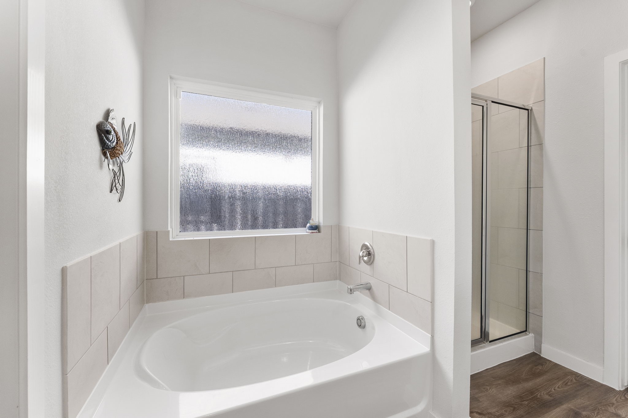Separate shower in primary bath.