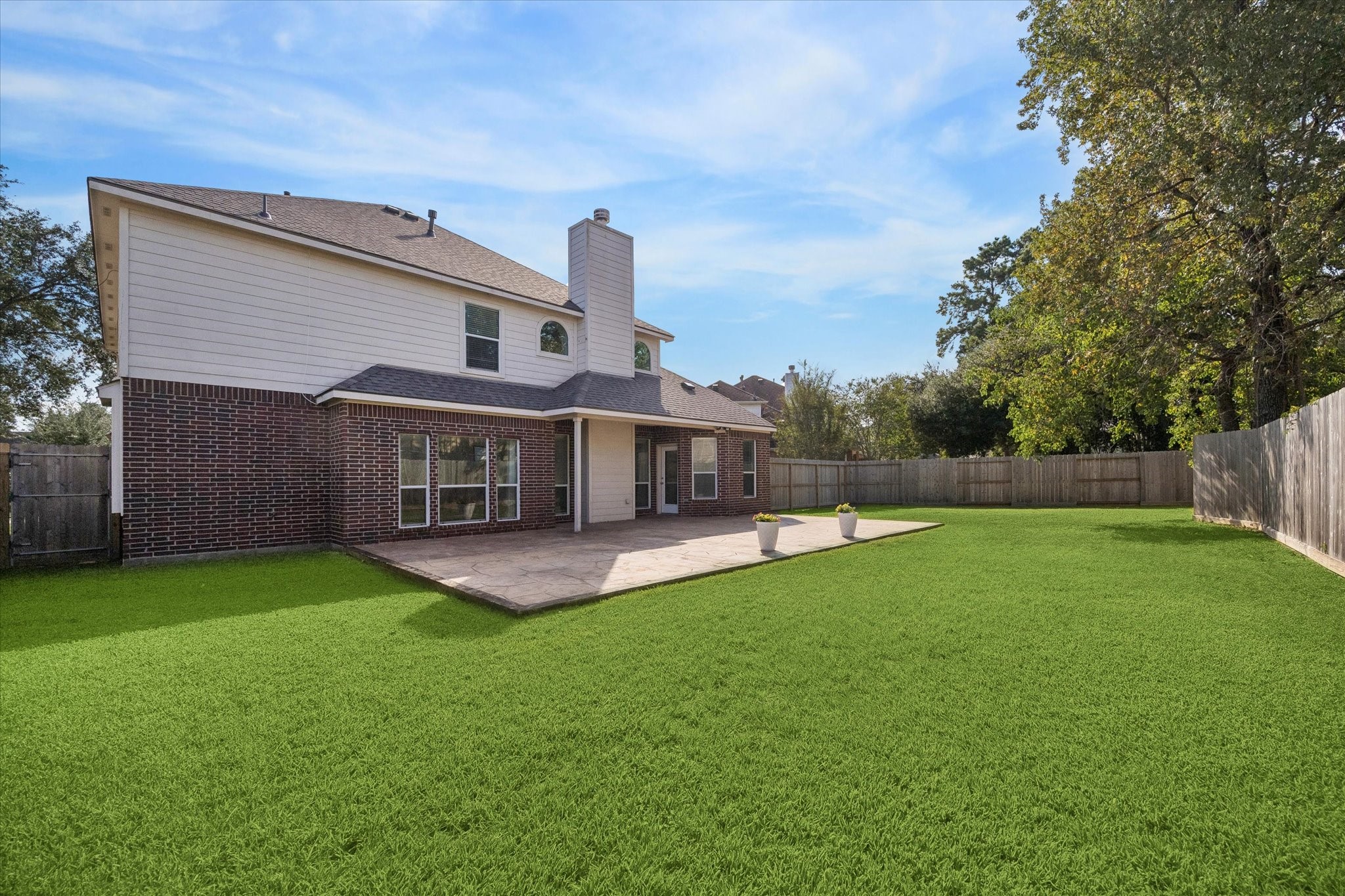 The lawn is a blank slate - leave it as is to give everyone room to run and roam, design garden areas, or even add a pool! Create your dream backyard oasis!