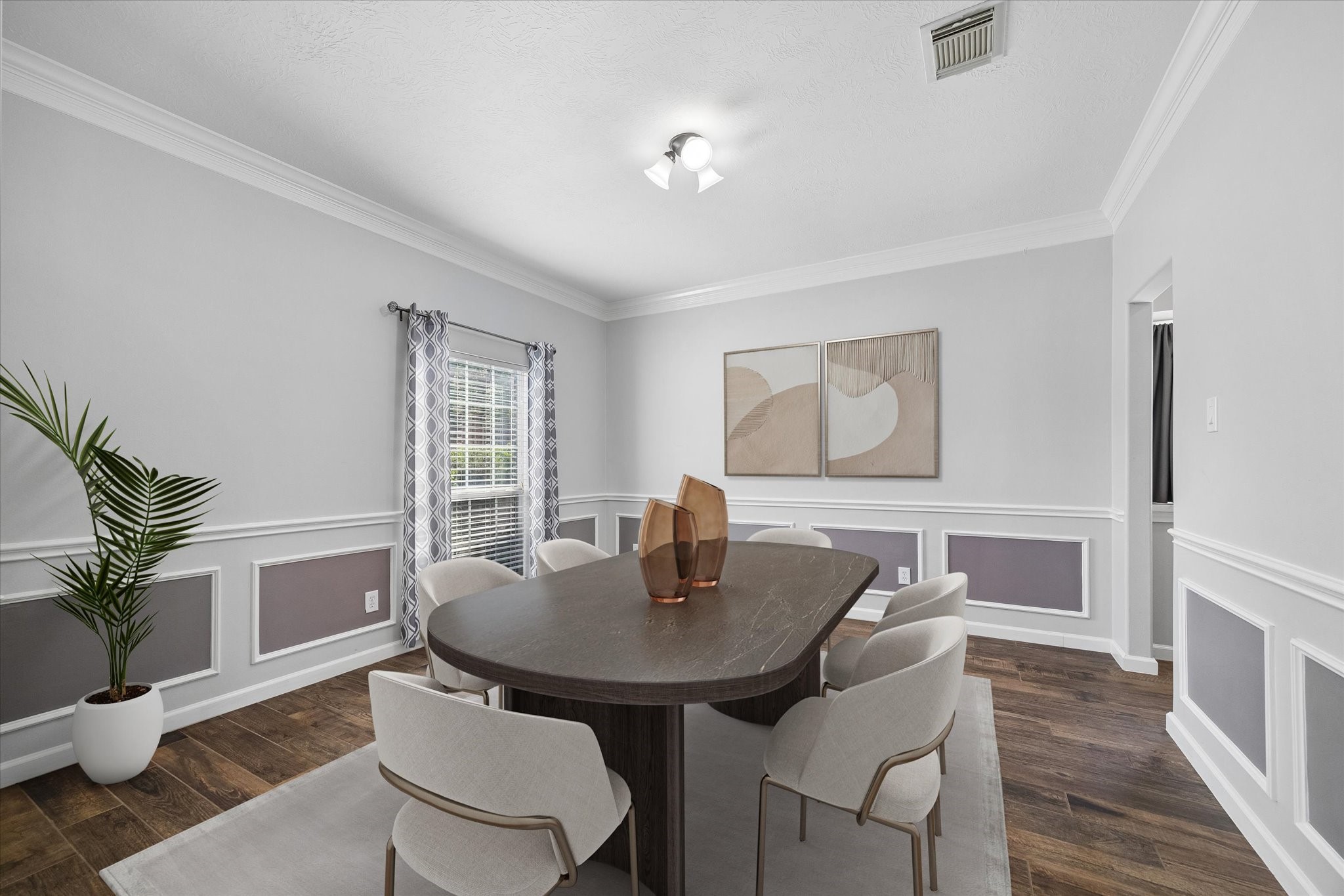 The formal dining room overlooks the front yard and provides a perfect spot to enjoy meals with family and friends.  It can accommodate a large dining set!