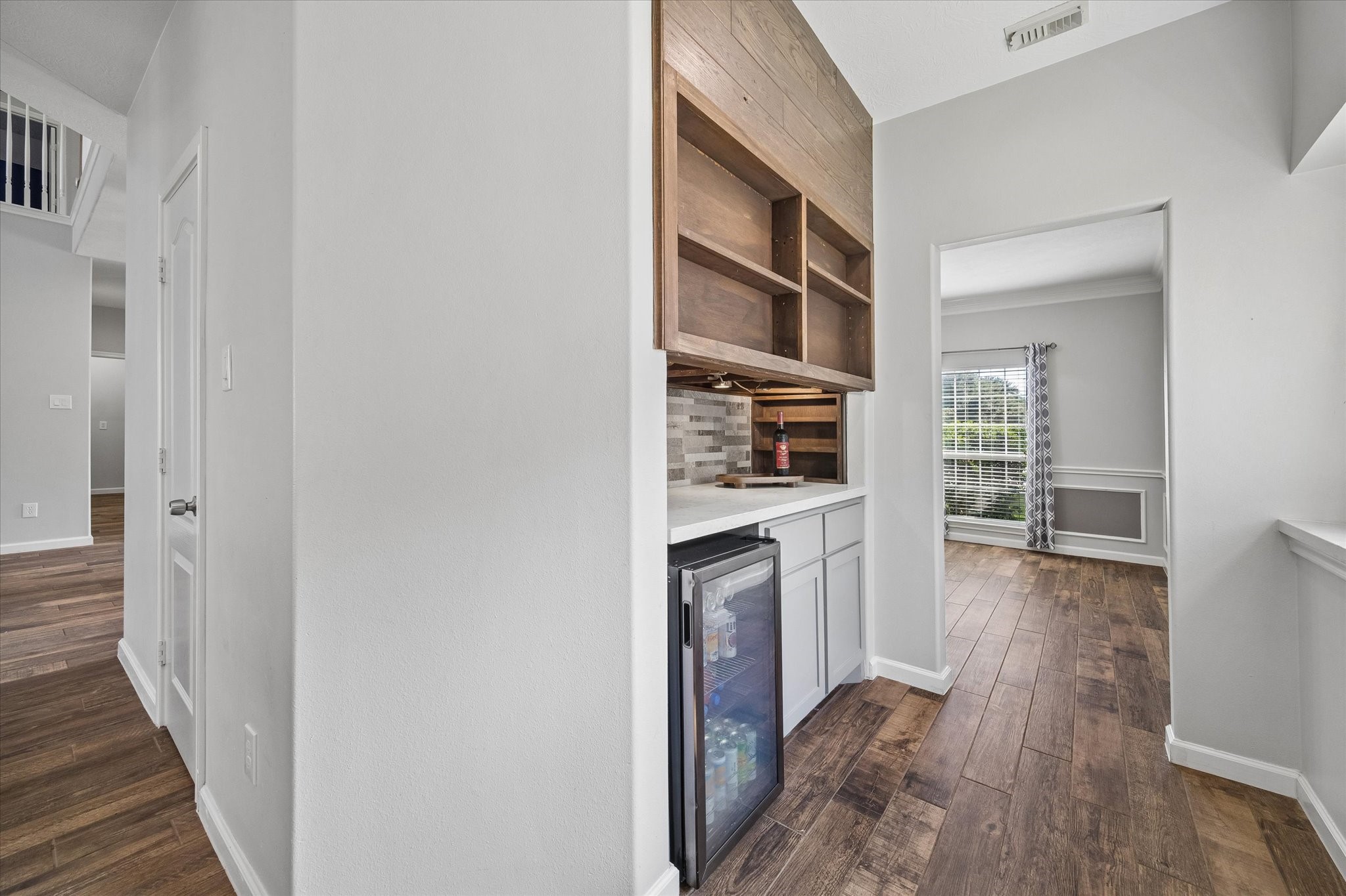 A dry bar/butler's pantry between the dining room and kitchen makes entertaining a breeze!