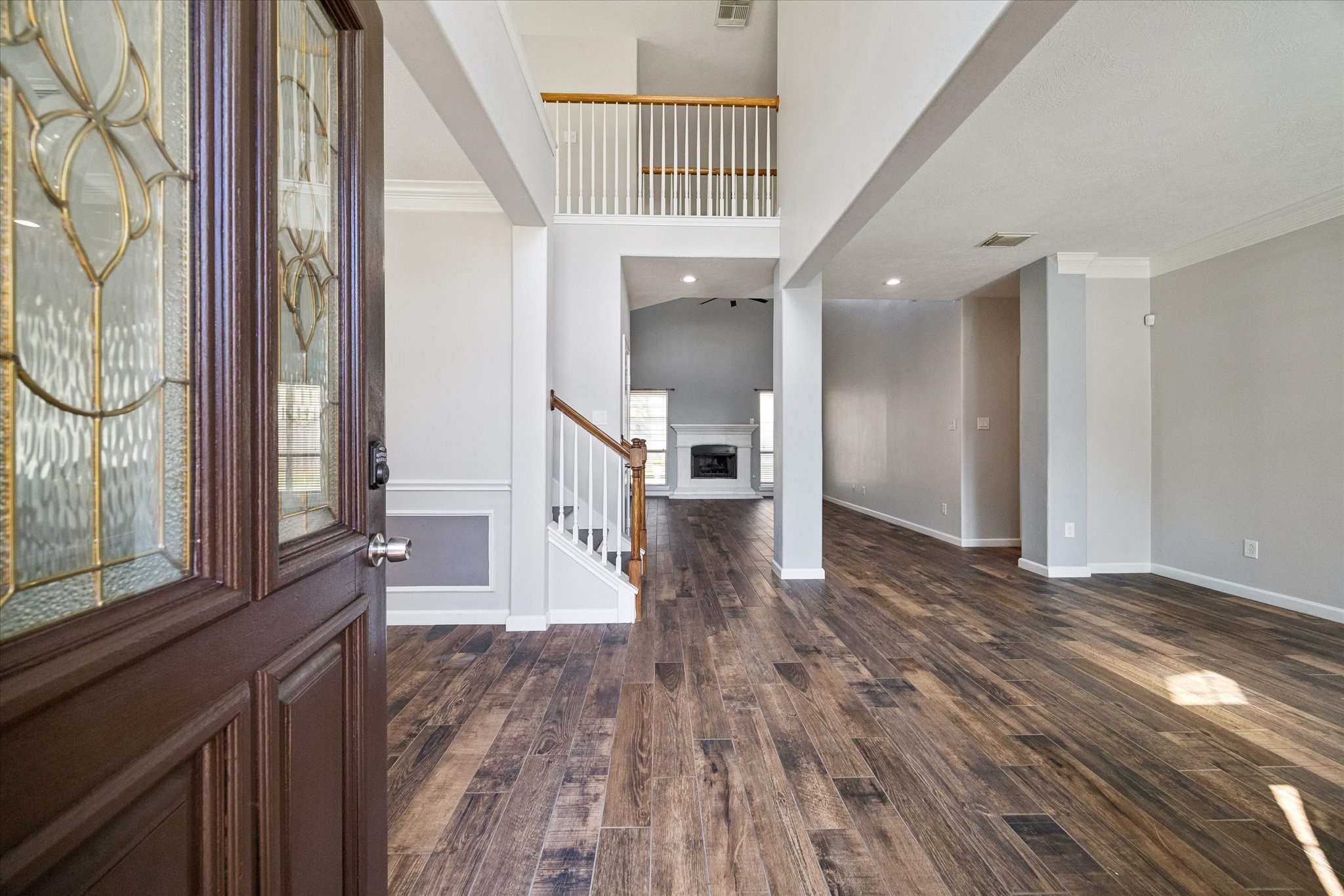 Inside you'll find SOARING CEILINGS in the entryway and OPEN SPACES to welcome your guests. Beautiful CONSISTENT FLOORING runs throughout the common areas.