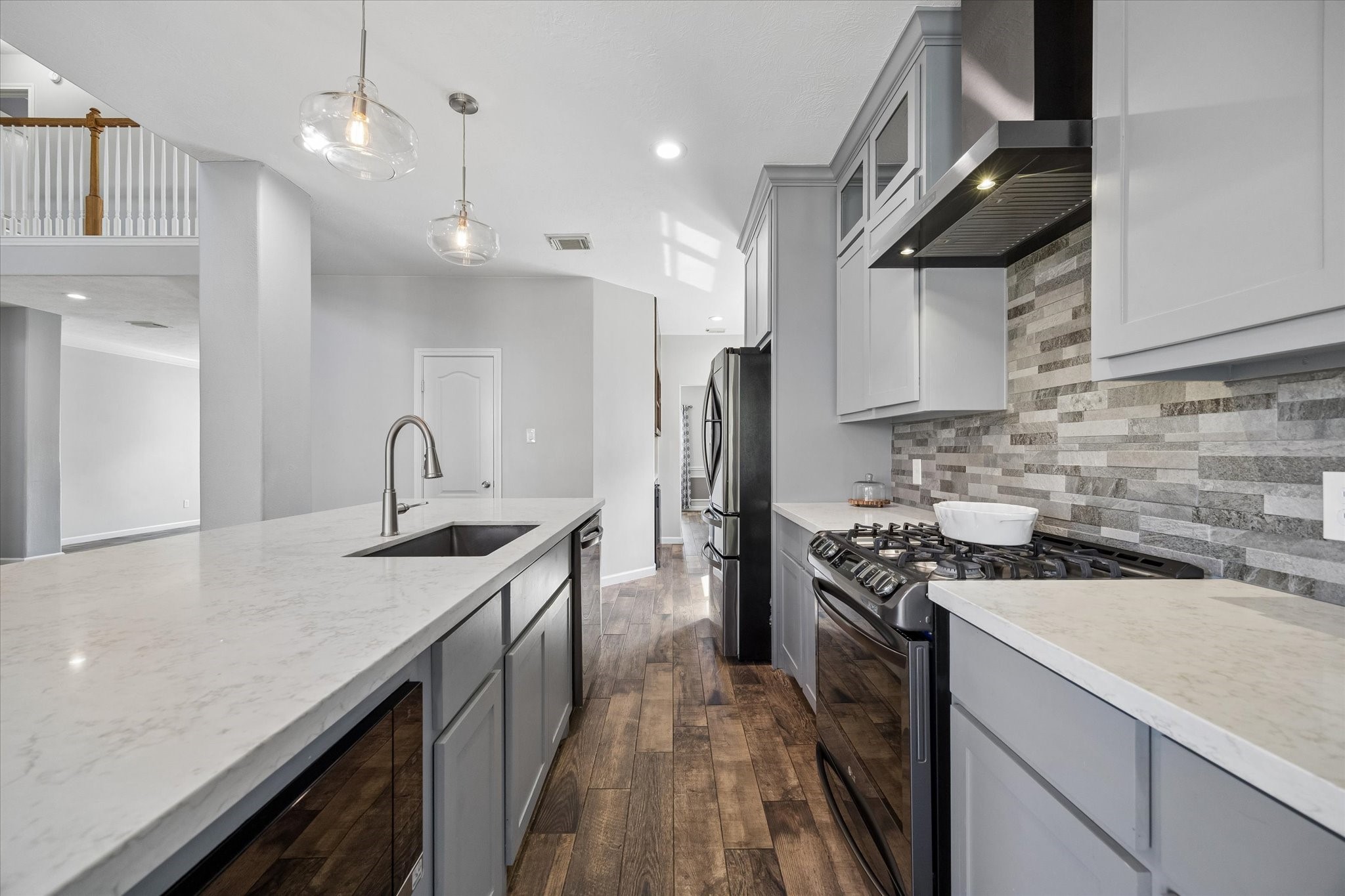 Your new kitchen features high-end LG appliances including a 5-burner gas stove, built-in microwave, and upgraded refrigerator with an INSTA-VIEW DOOR.