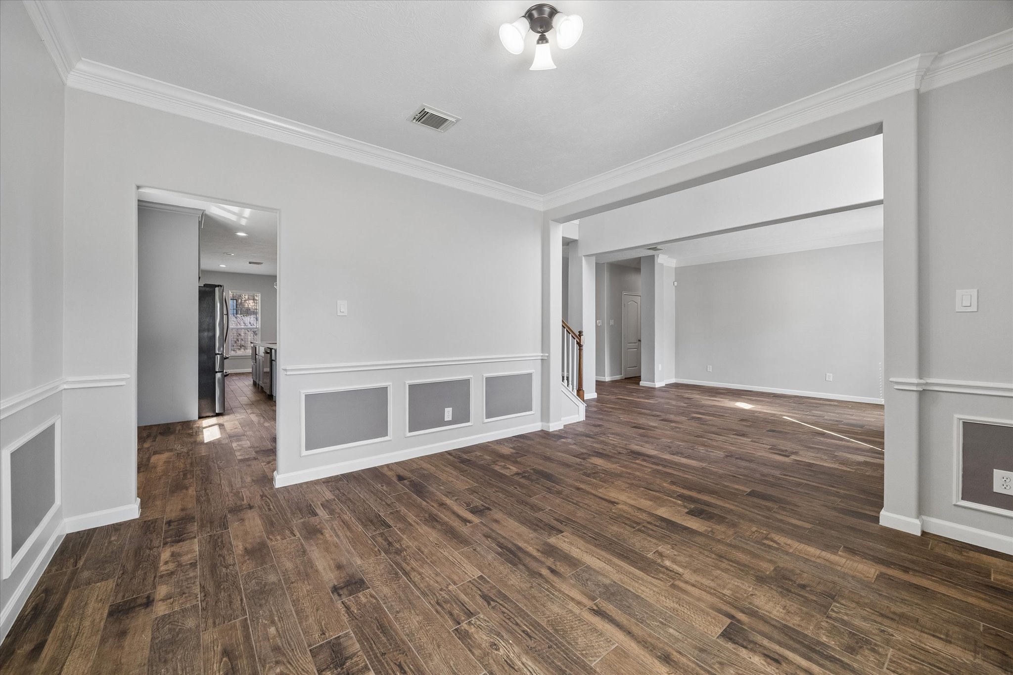 The dining room connects to a dry bar/butler's pantry and kitchen through the doorway on the left making entertaining a breeze!