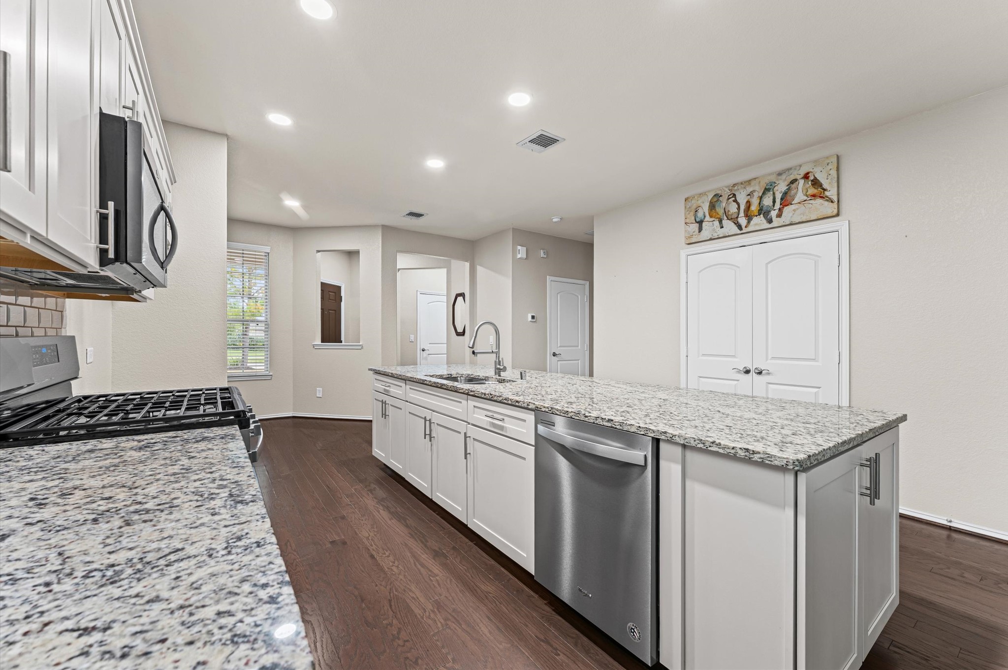 This kitchen features a highly convenient pantry and cabinets at the end of the island to provide plenty of storage for all your kitchen essentials.