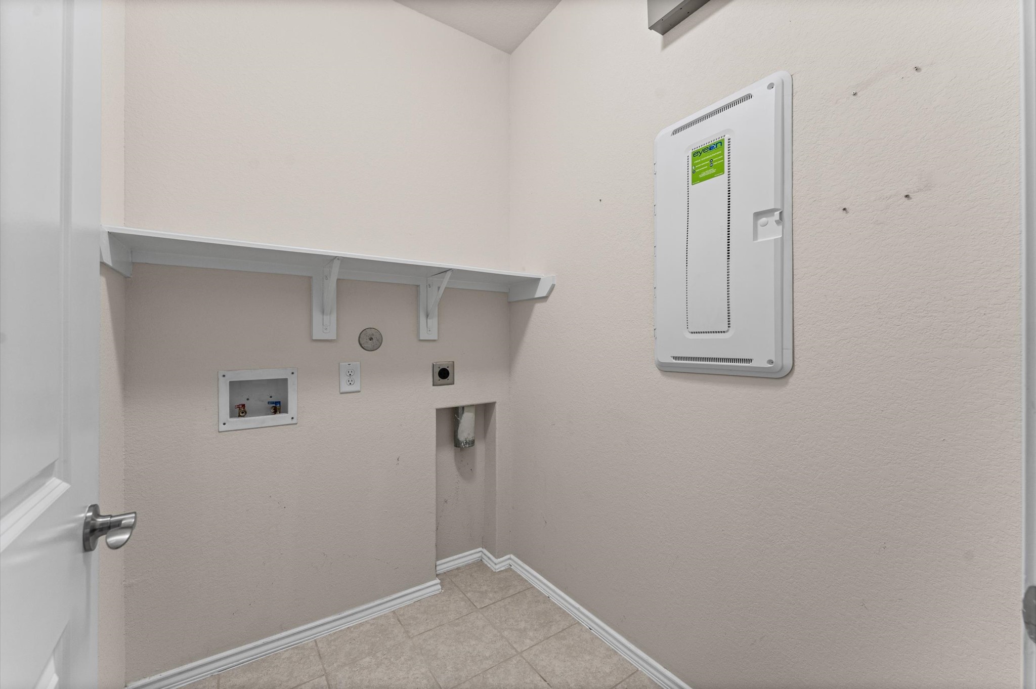 A modern utility room focused on home ease combines high-efficiency laundry workflows and streamlined organization.